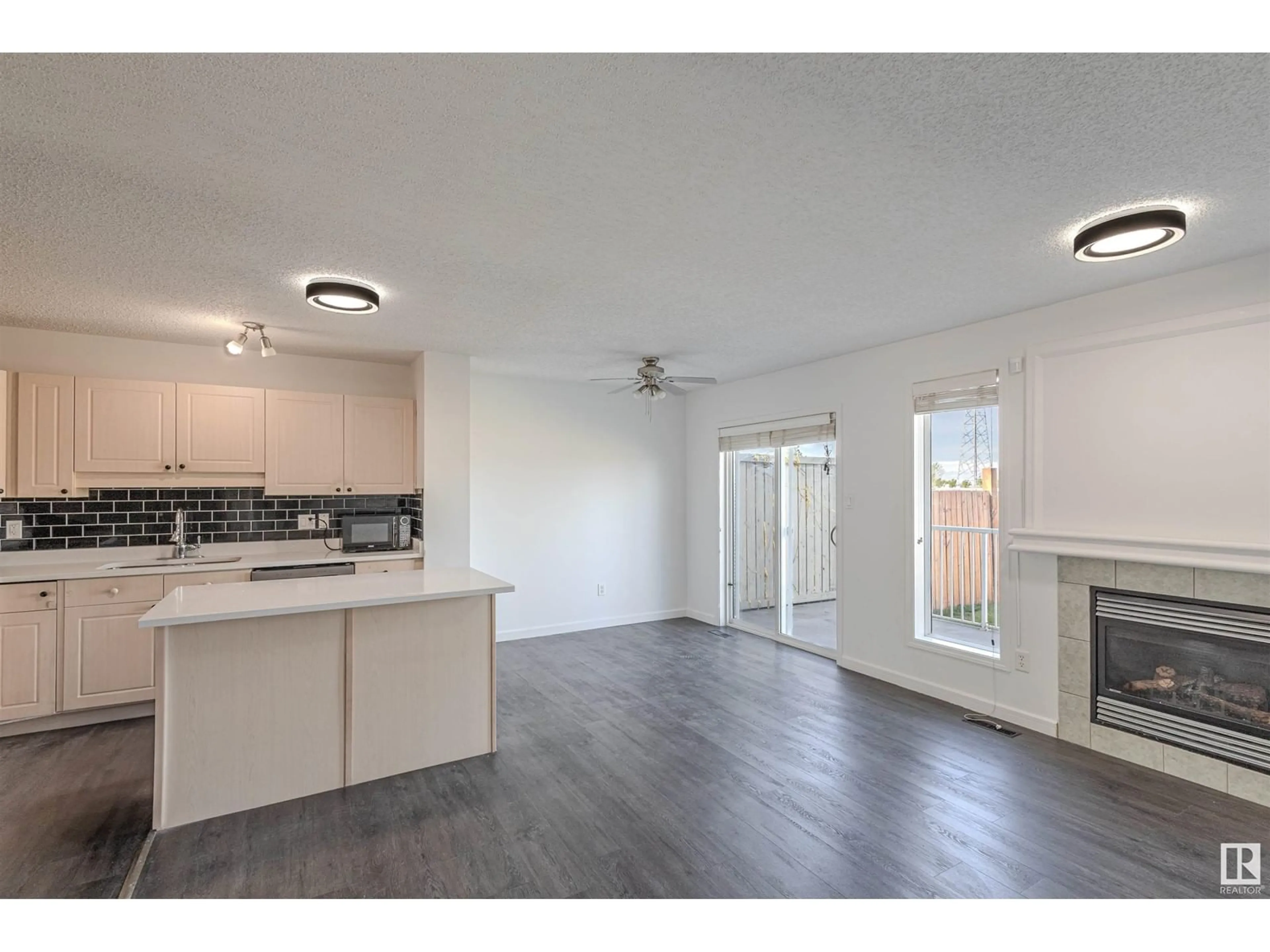 Open concept kitchen, wood/laminate floor for 2832 26 STREET, Edmonton Alberta T6T2A2