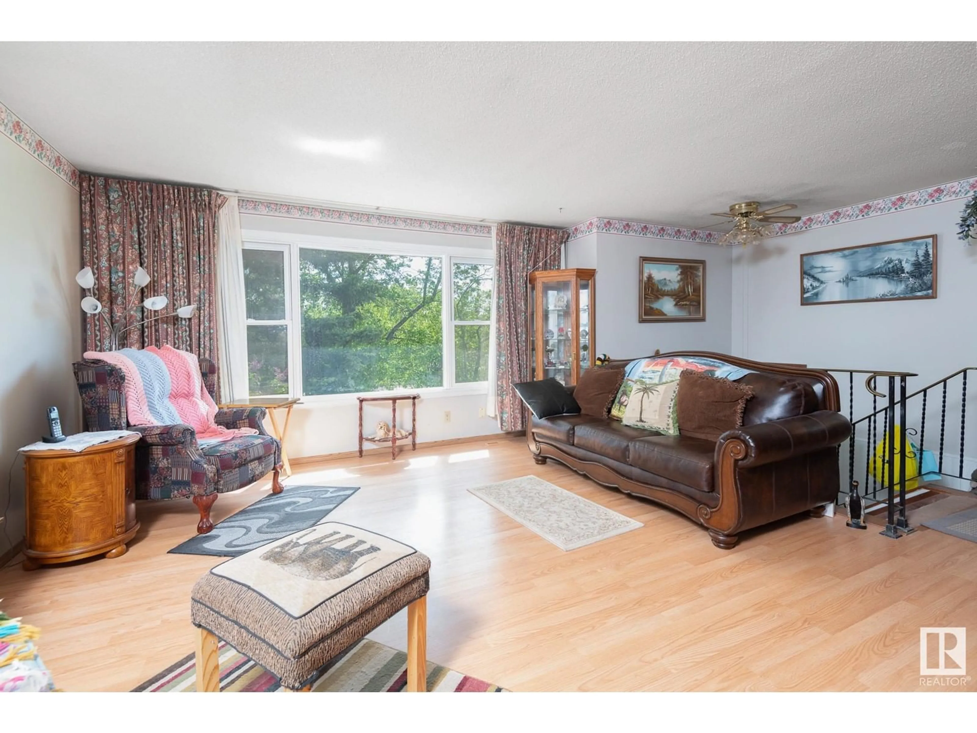 Living room with furniture, wood/laminate floor for 4826 51 AV, Cold Lake Alberta T9M1Y1