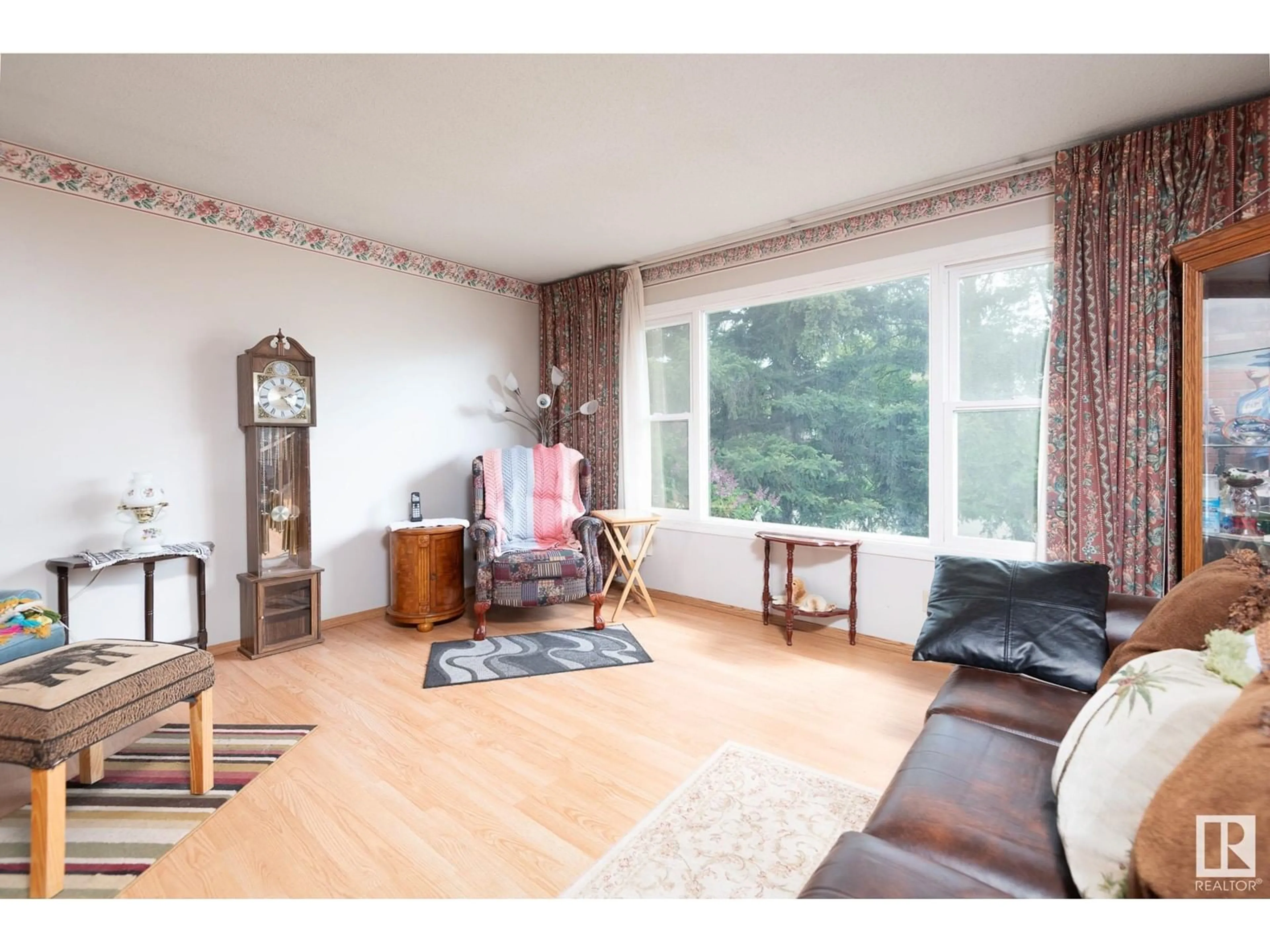 Living room with furniture, wood/laminate floor for 4826 51 AV, Cold Lake Alberta T9M1Y1