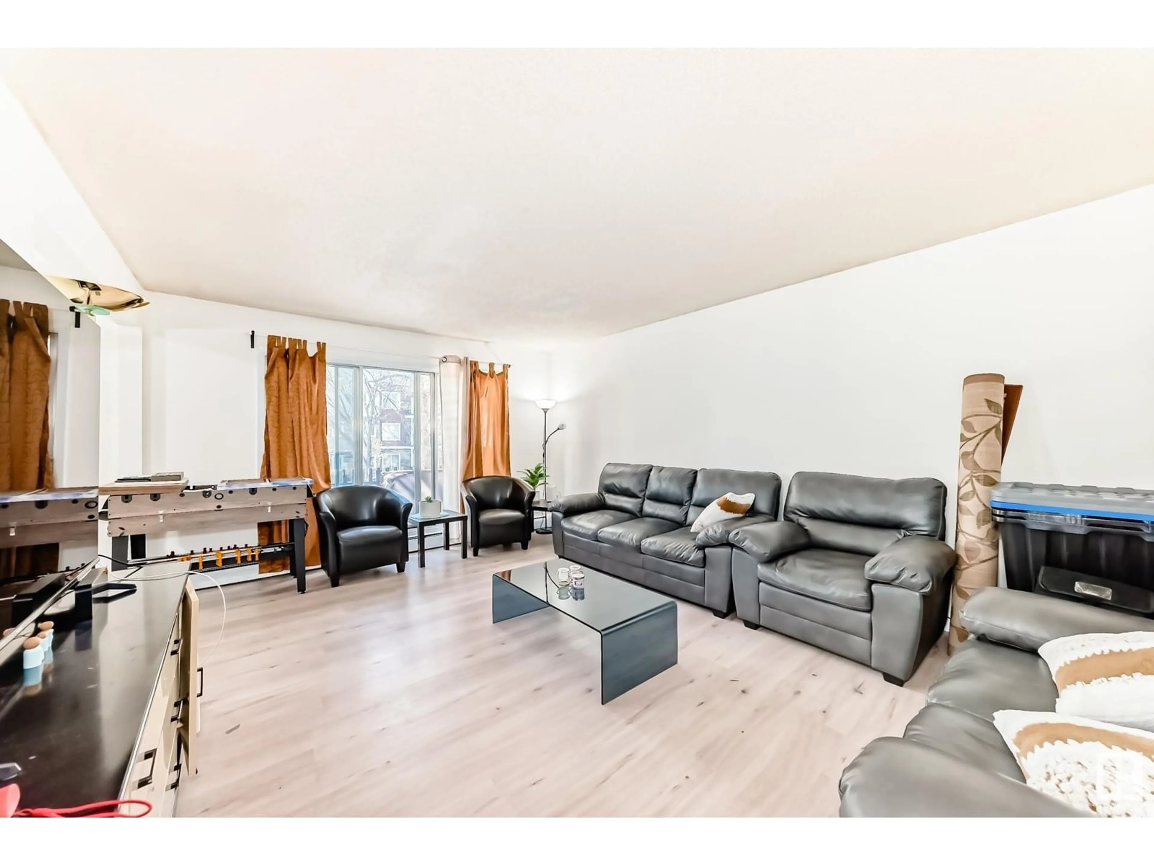 Living room with furniture, wood/laminate floor for #207 - 11907 81 ST, Edmonton Alberta T5B2S7