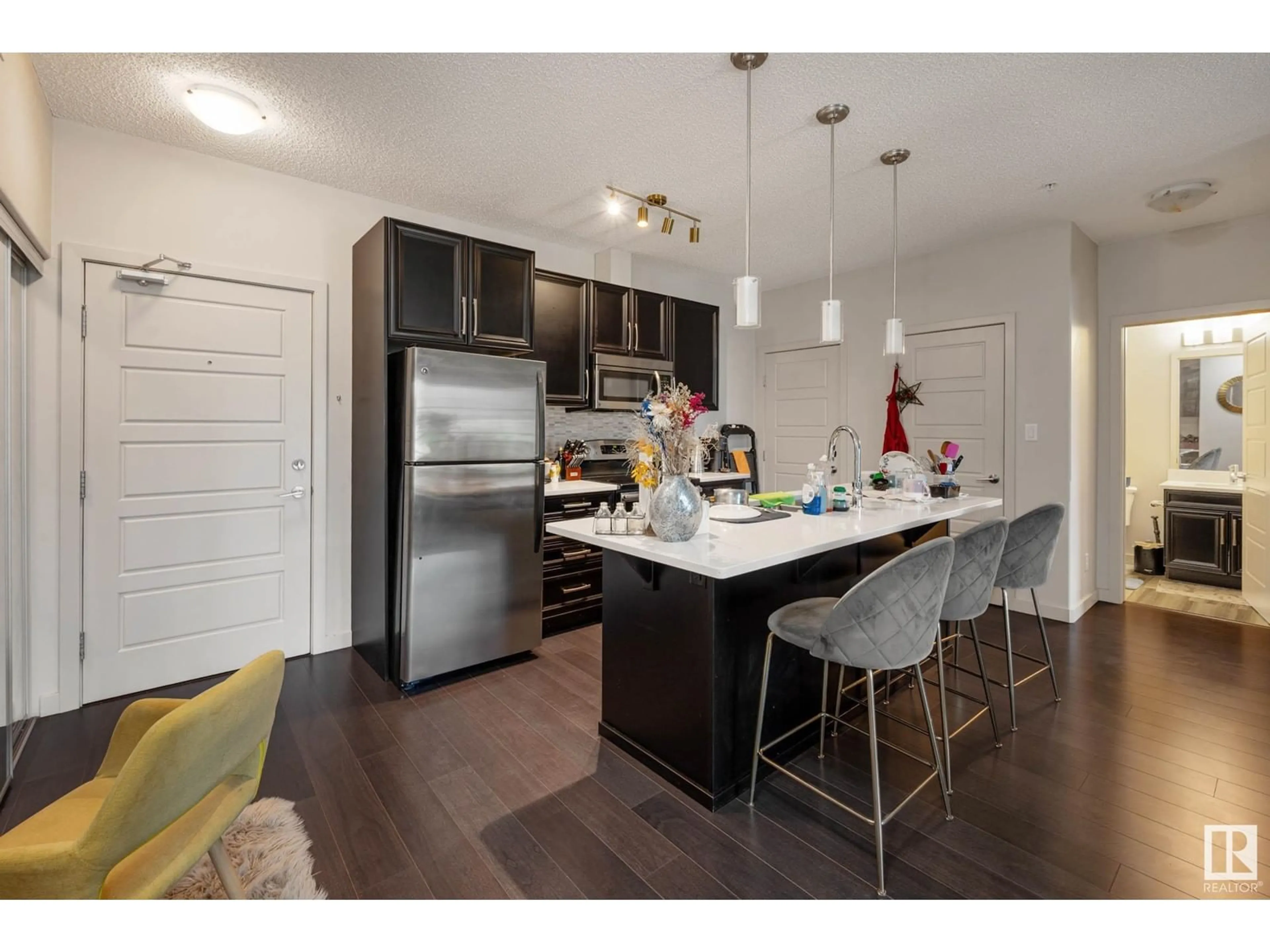 Open concept kitchen, wood/laminate floor for 318 - 1144 ADAMSON DR, Edmonton Alberta T6W2X7