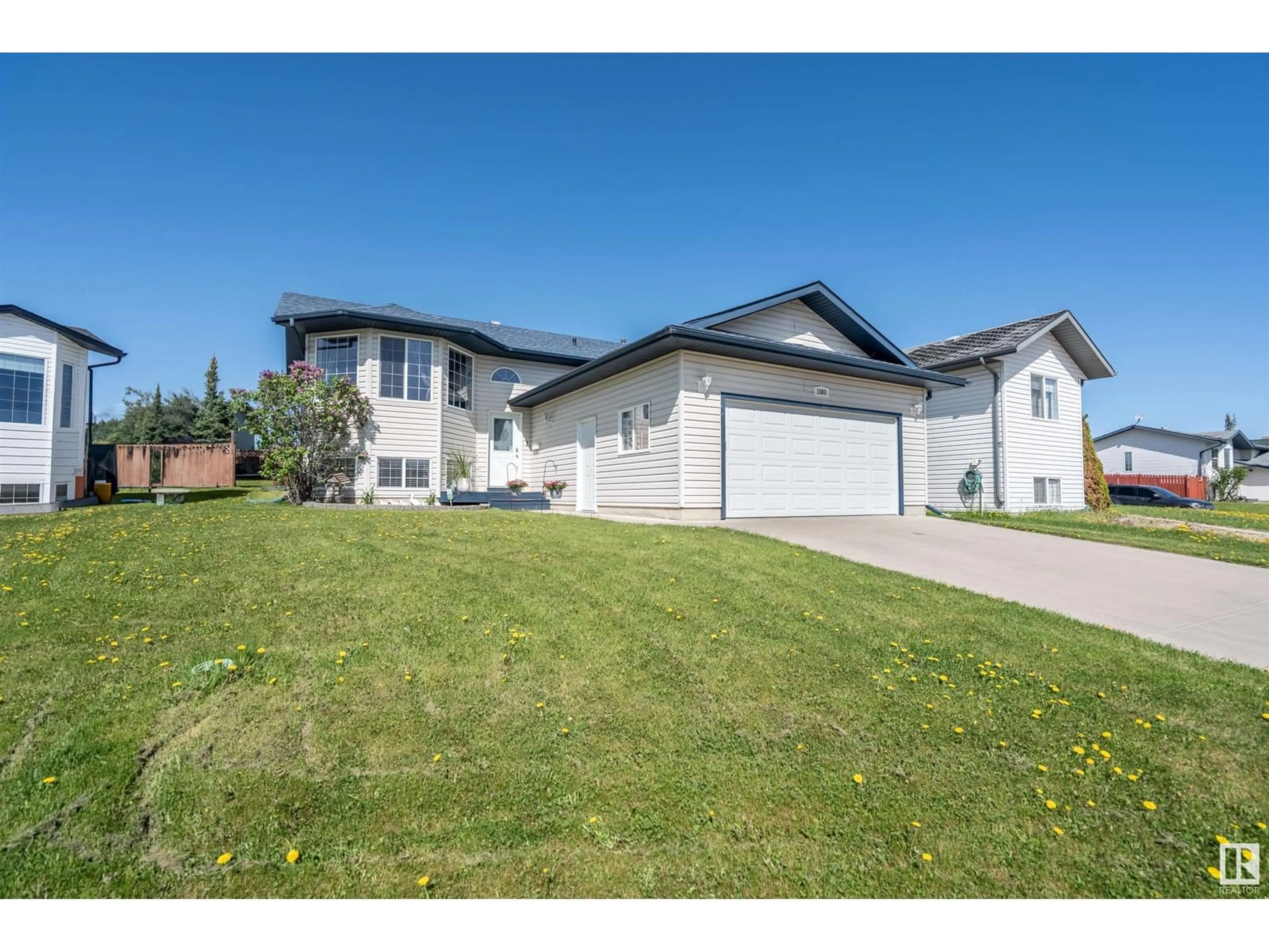 Home with vinyl exterior material, street for 1503 14 ST, Cold Lake Alberta T9M1Z8