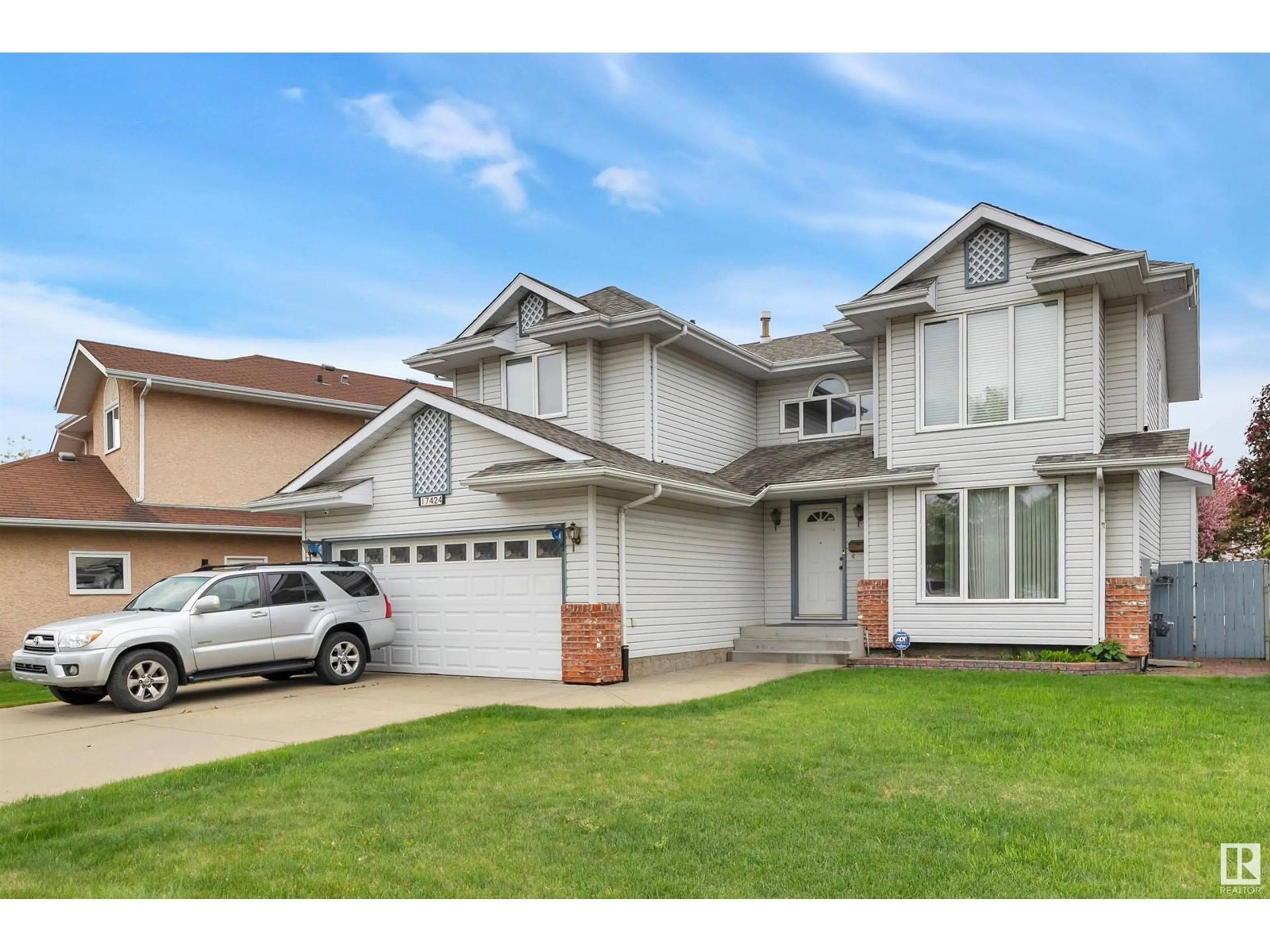 Home with vinyl exterior material, street for NW - 17424 100 ST, Edmonton Alberta T5X5V7