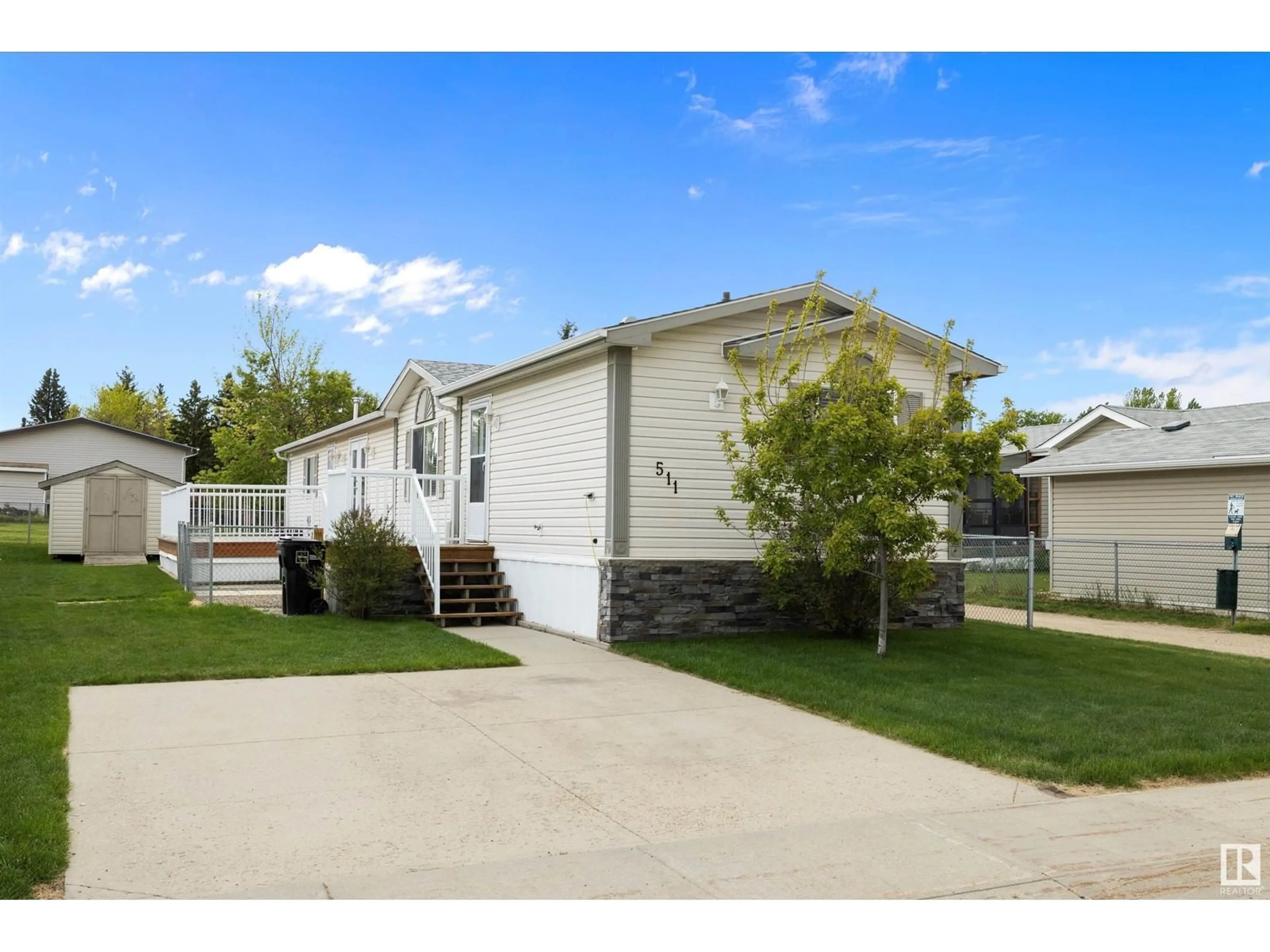 Home with vinyl exterior material, street for 511 MAPLE WOOD CR, Edmonton Alberta T6P0B1