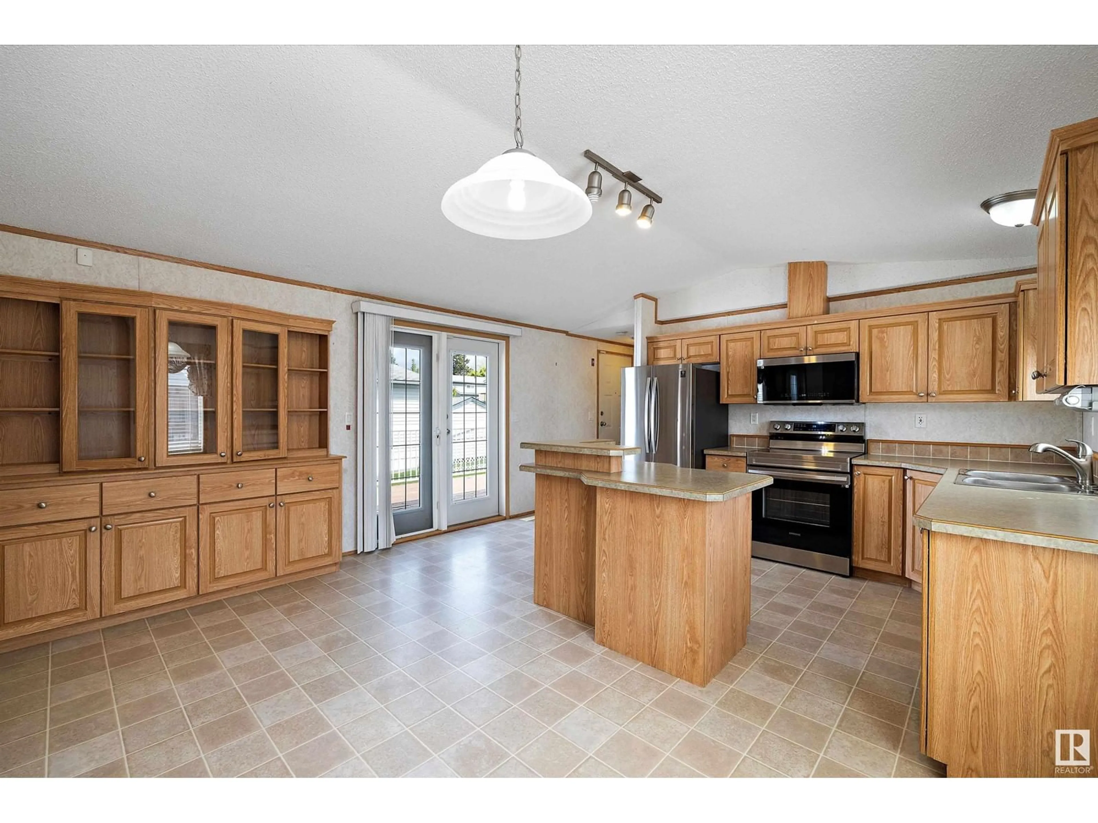 Open concept kitchen, ceramic/tile floor for 511 MAPLE WOOD CR, Edmonton Alberta T6P0B1