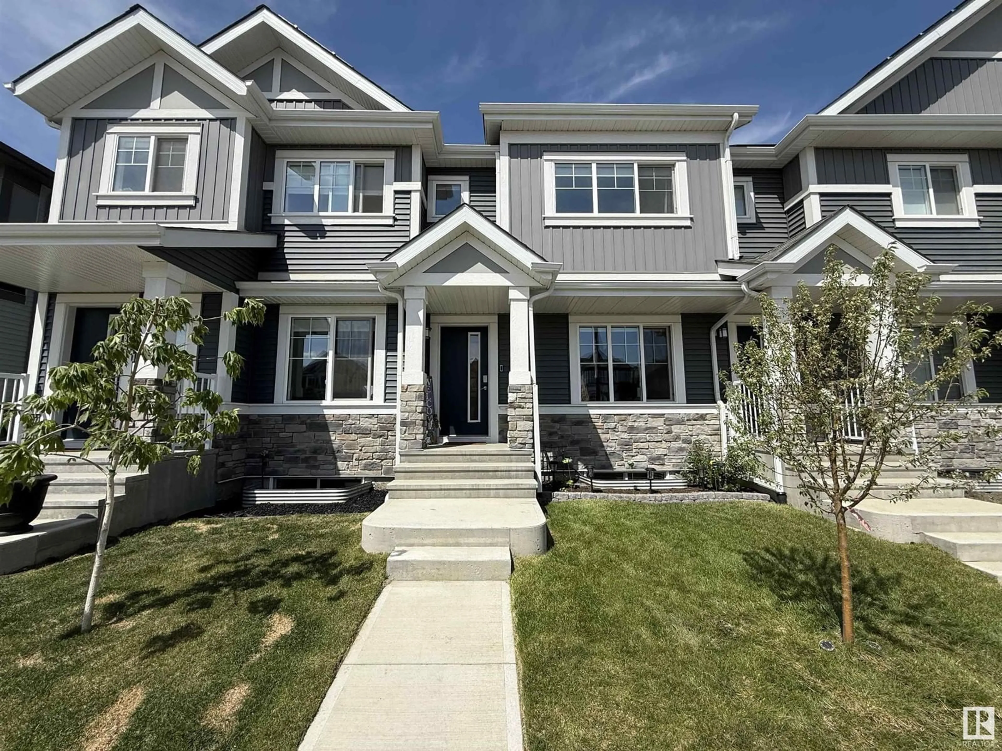 Home with vinyl exterior material, street for 2424 TRUMPETER WY, Edmonton Alberta T5S0R9