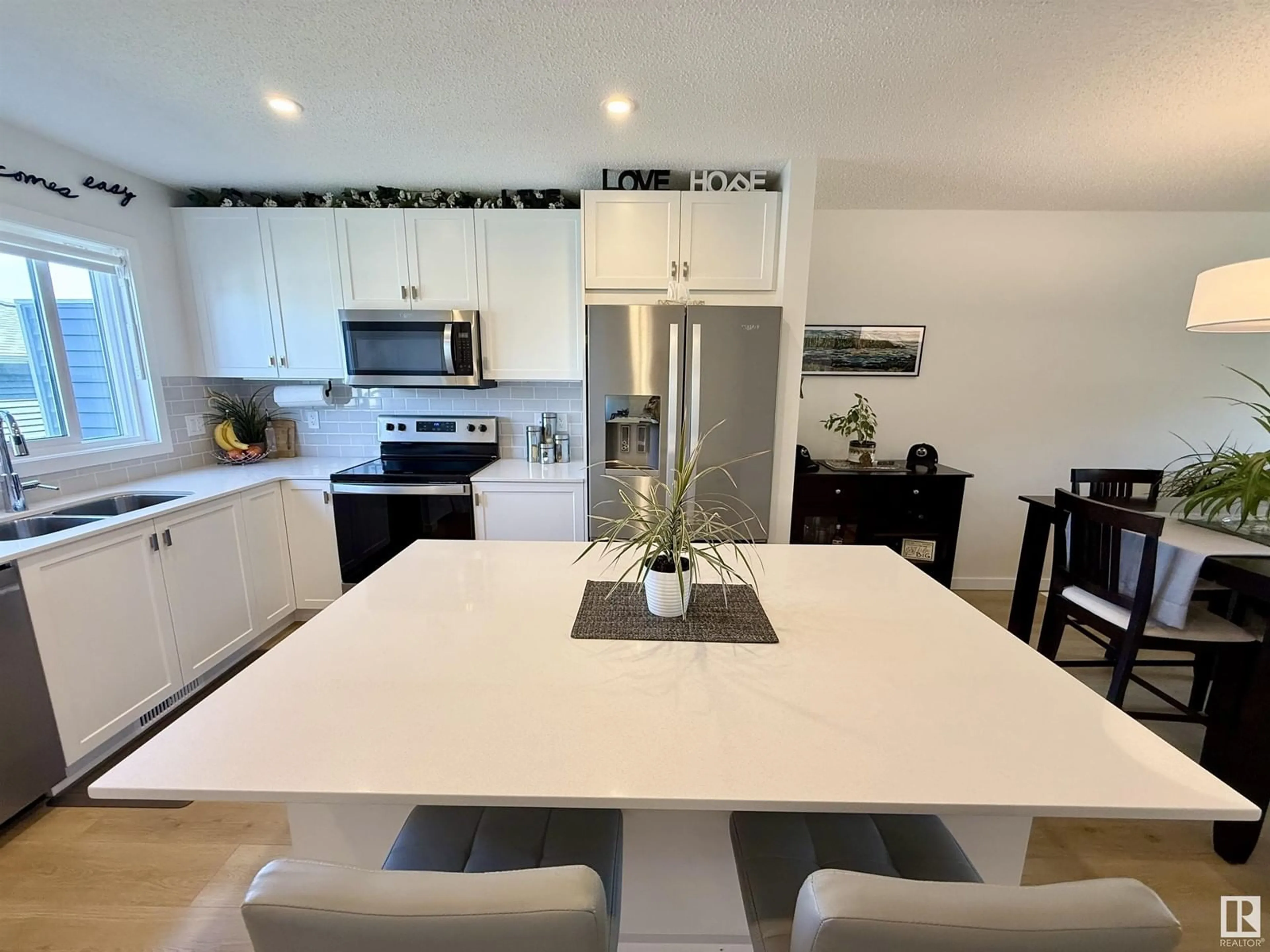 Open concept kitchen, ceramic/tile floor for 2424 TRUMPETER WY, Edmonton Alberta T5S0R9