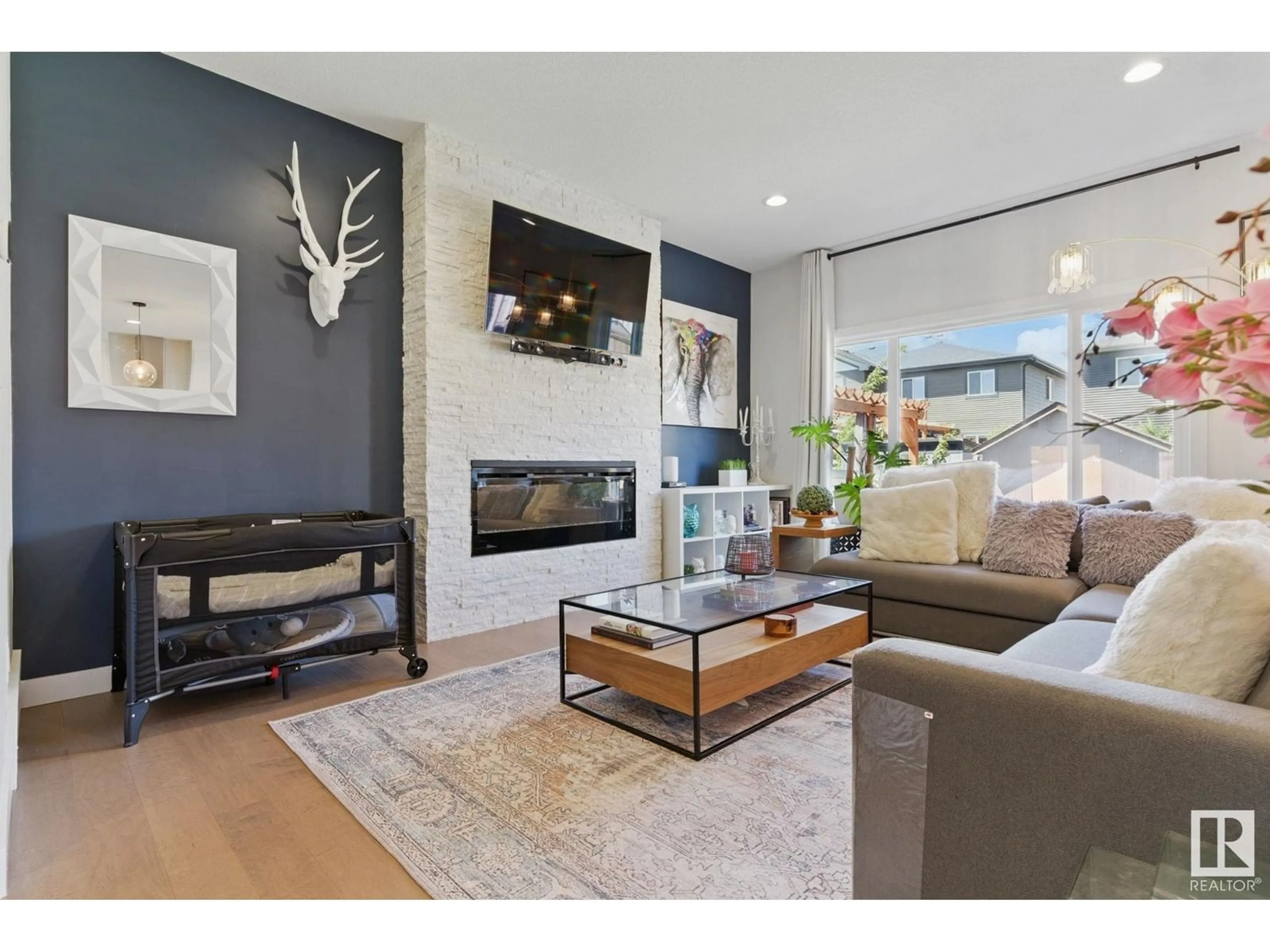 Living room with furniture, wood/laminate floor for 904 BERG PL, Leduc Alberta T9E1H2