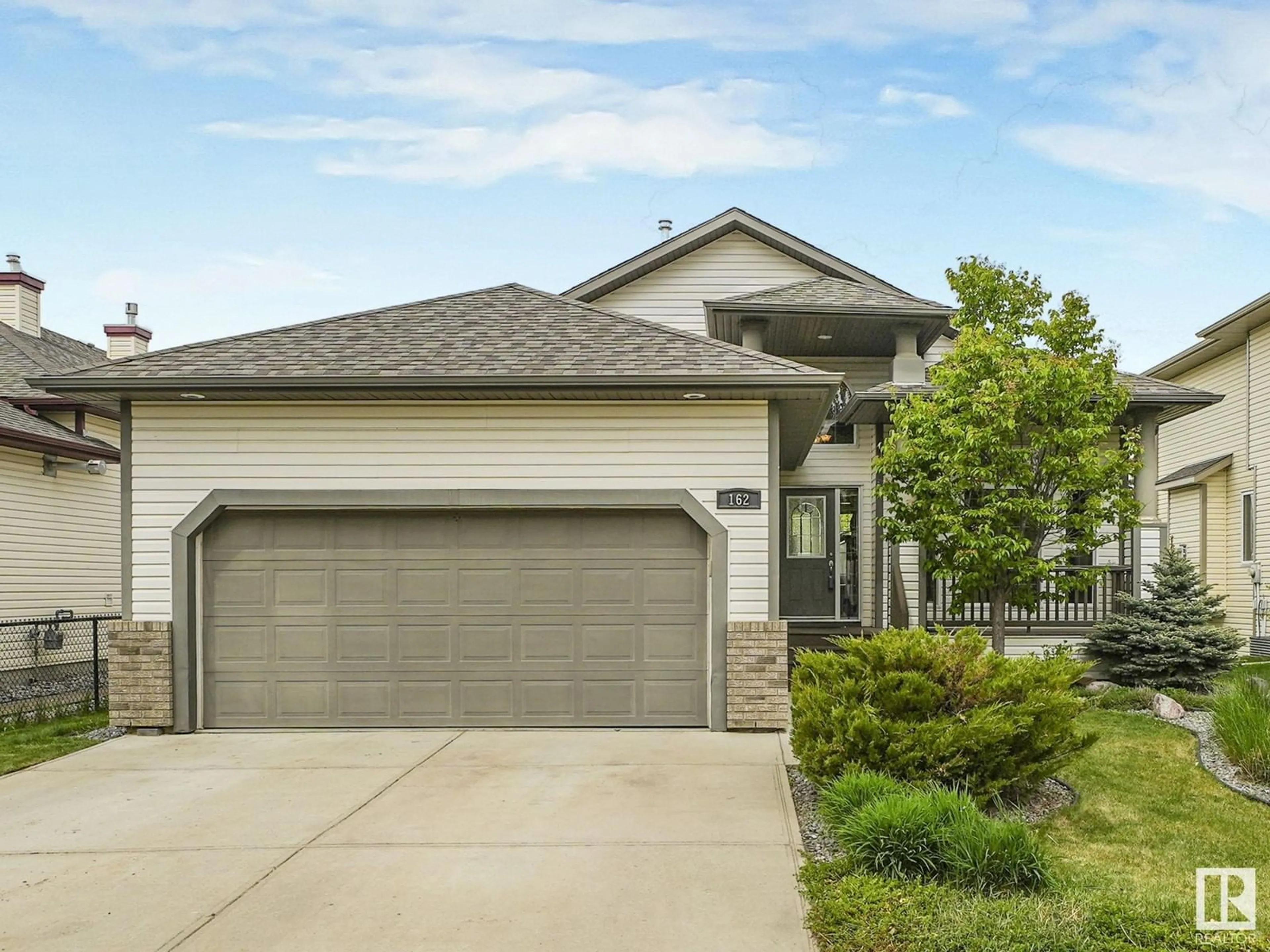 Home with vinyl exterior material, street for 162 REICHERT DR, Beaumont Alberta T4X0B8