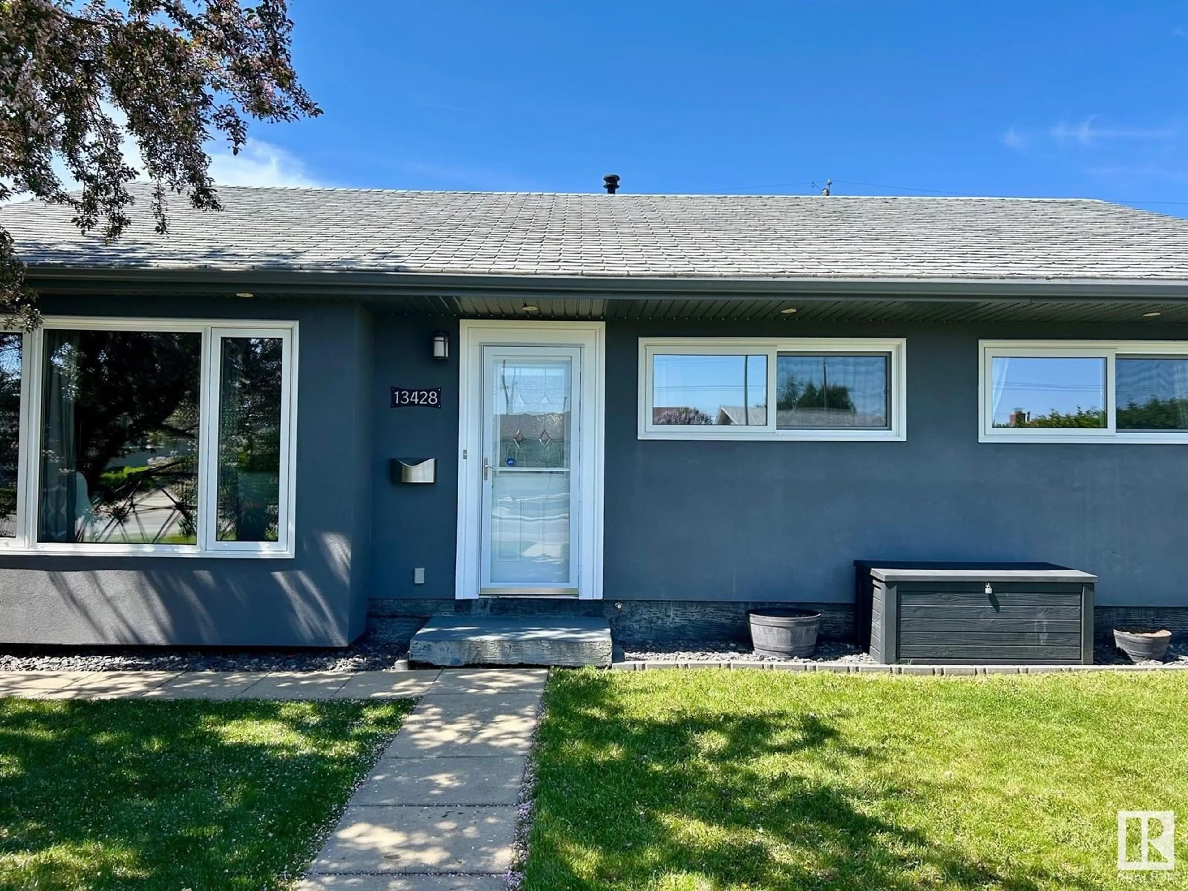 Home with vinyl exterior material, street for 13428 135 ST, Edmonton Alberta T5L1Y9