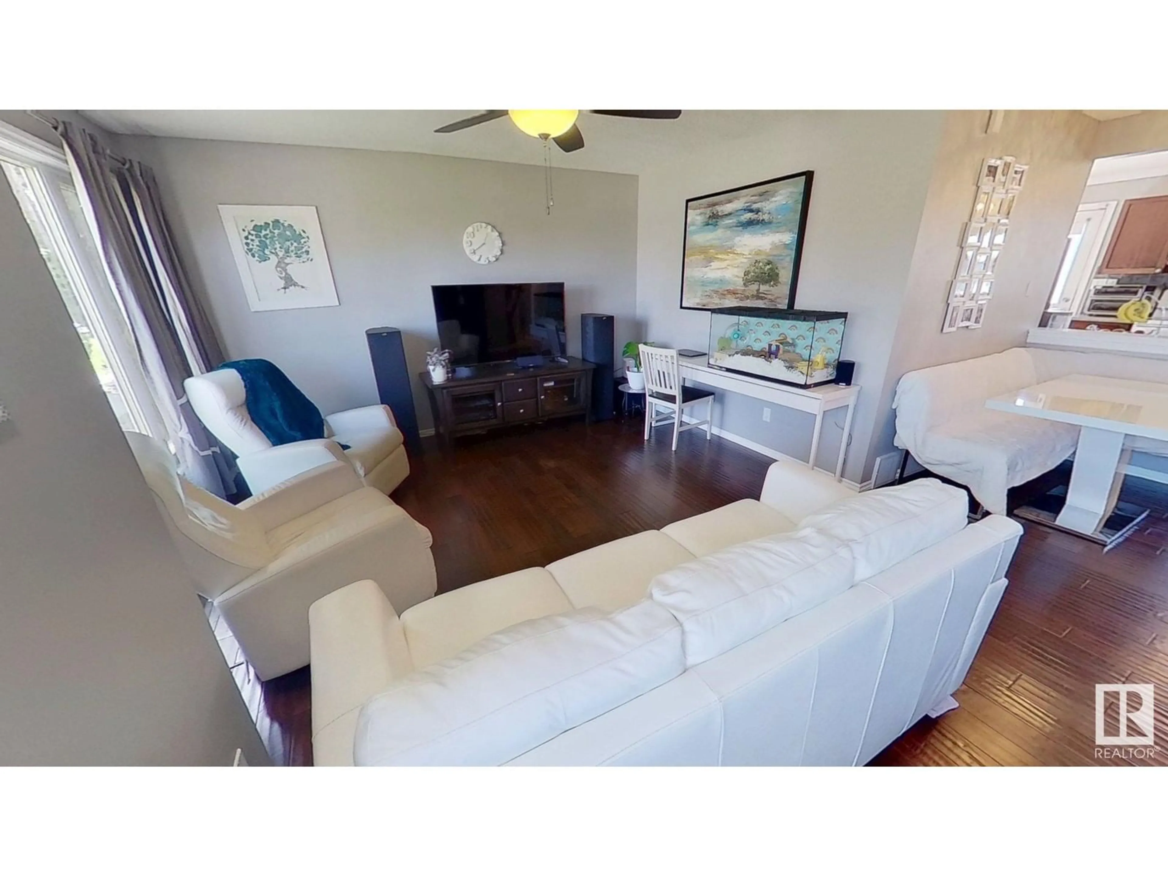 Living room with furniture, wood/laminate floor for 13428 135 ST, Edmonton Alberta T5L1Y9