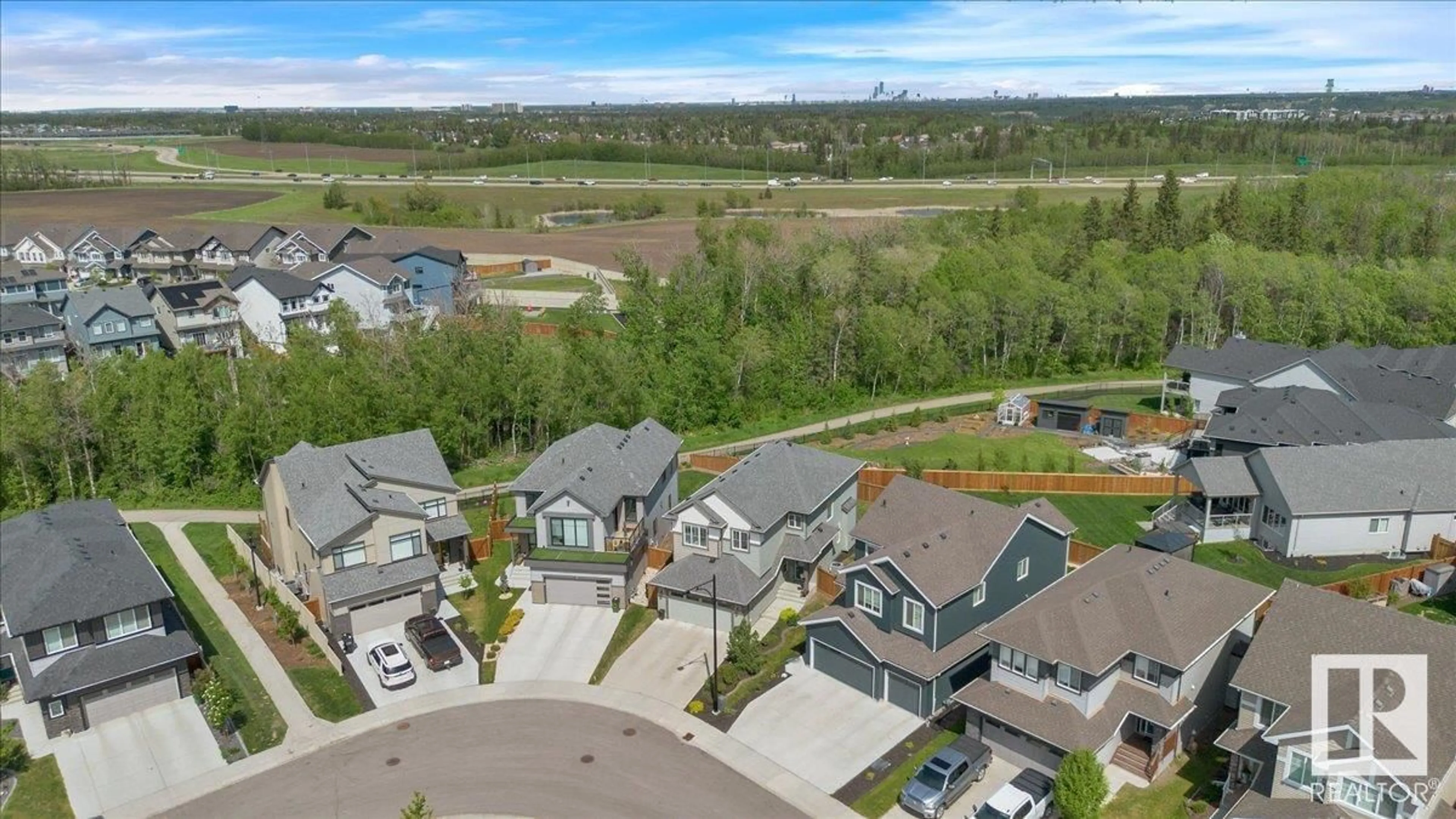 A pic from outside/outdoor area/front of a property/back of a property/a pic from drone, mountain view for NW - 515 EAGLETON WD, Edmonton Alberta T6M0Y5