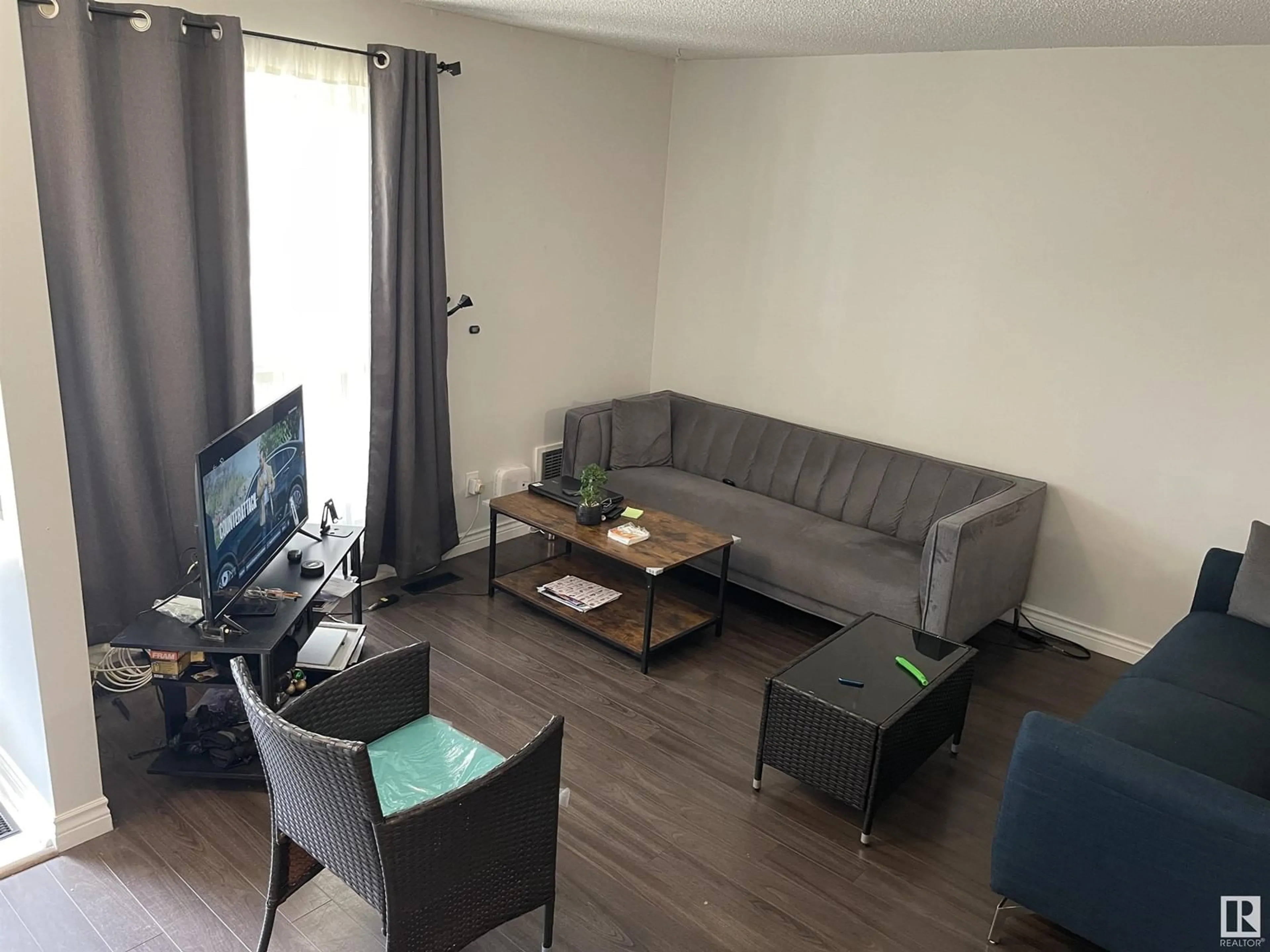 Living room with furniture, wood/laminate floor for NW - 9235 172 ST, Edmonton Alberta T5T3C3
