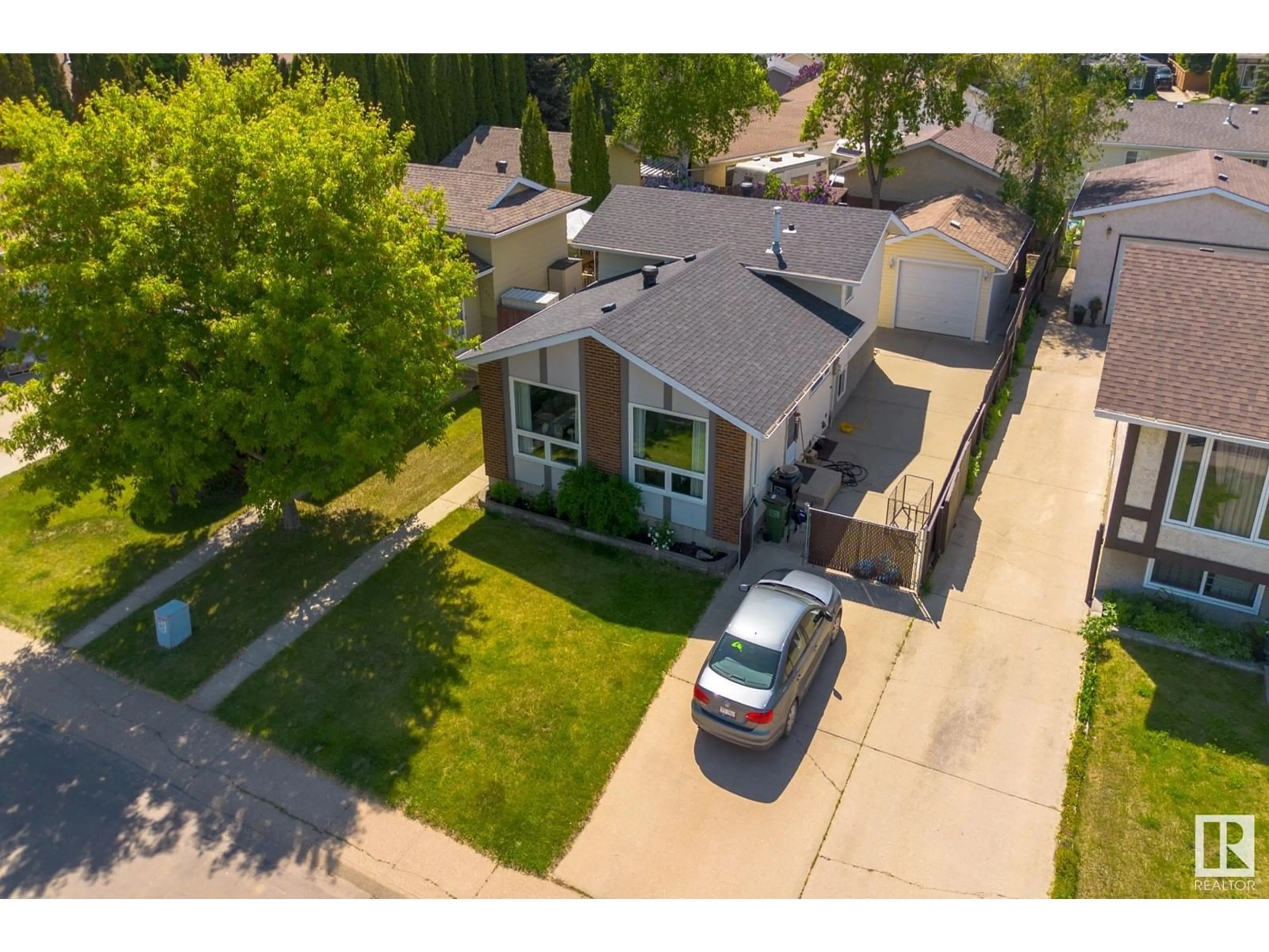 A pic from outside/outdoor area/front of a property/back of a property/a pic from drone, street for 2227 141 AVE, Edmonton Alberta T5Y1C4