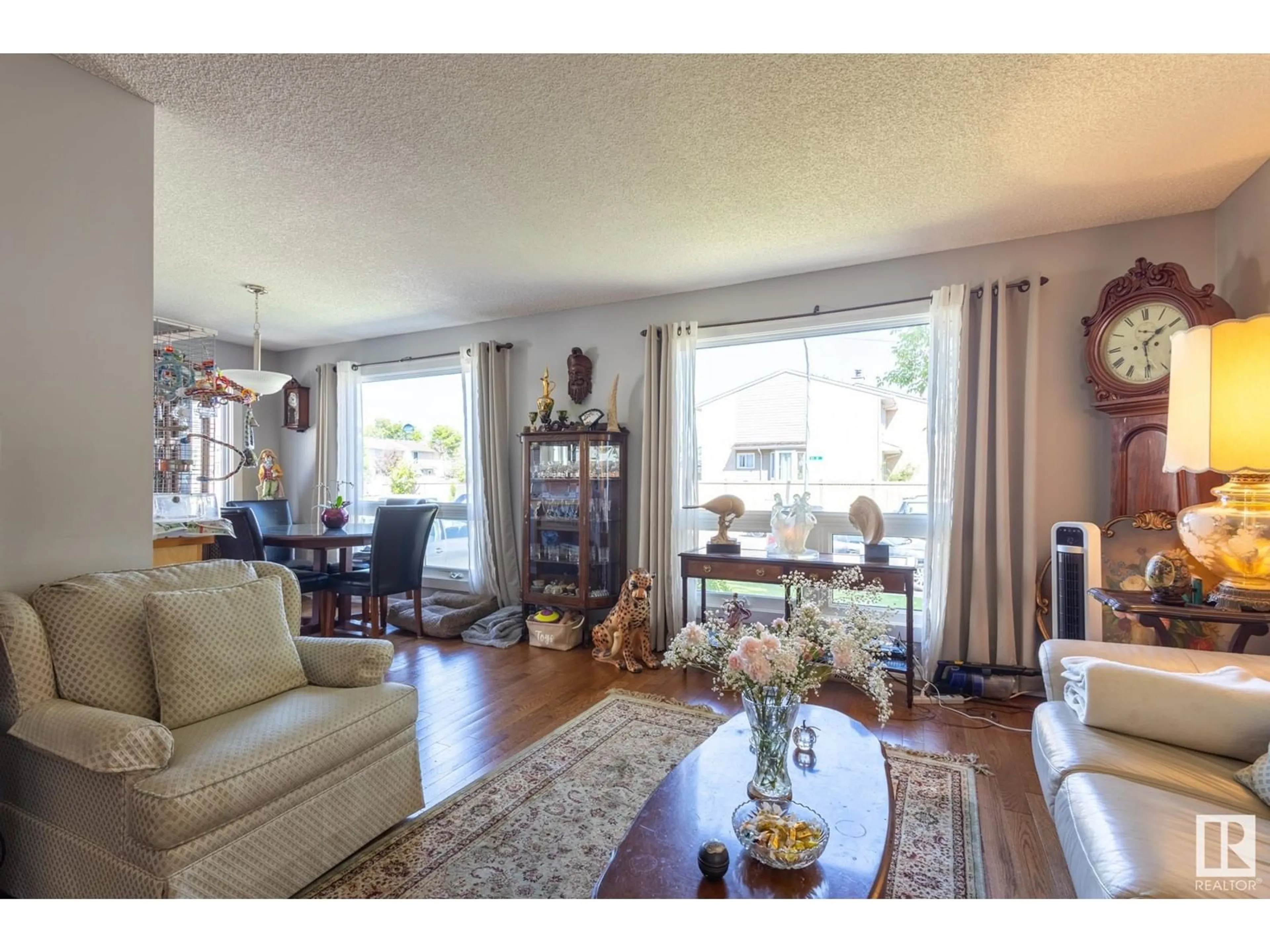 Living room with furniture, wood/laminate floor for 2227 141 AVE, Edmonton Alberta T5Y1C4