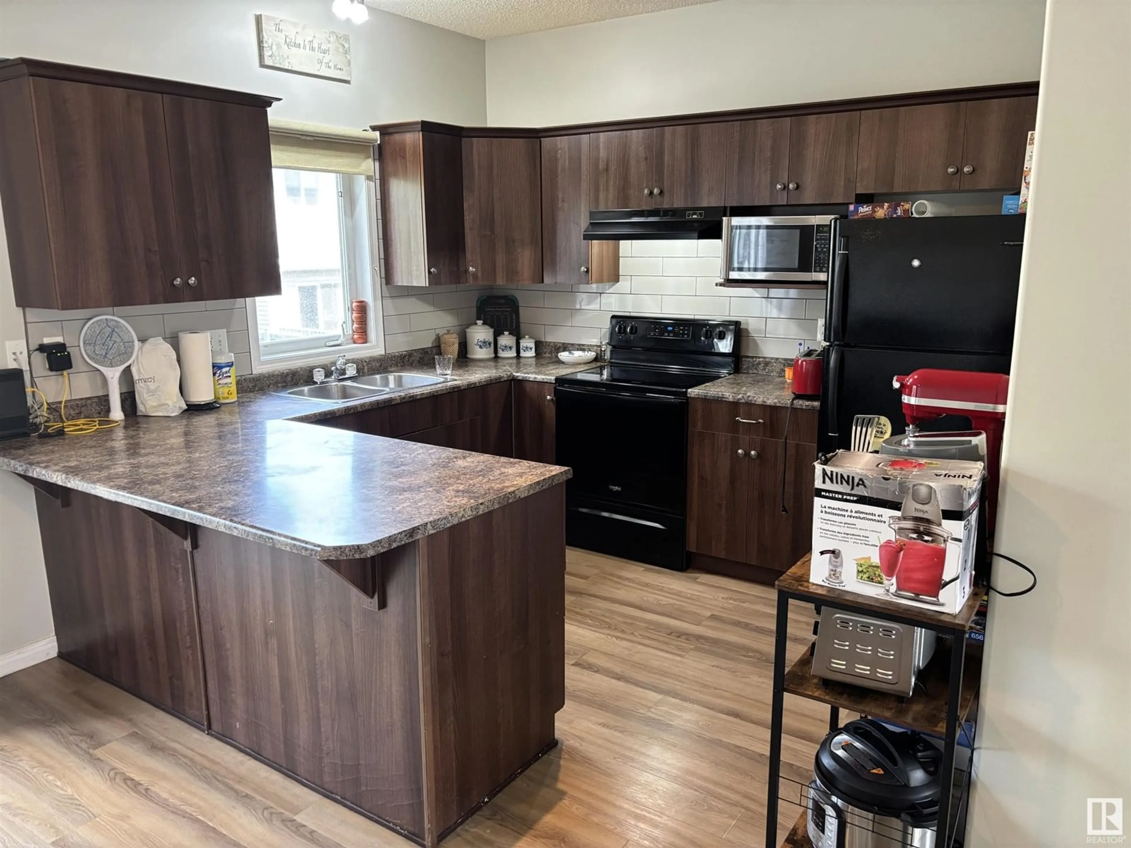 Standard kitchen, wood/laminate floor for 21 - 5102 30 AV, Beaumont Alberta T4X0A9
