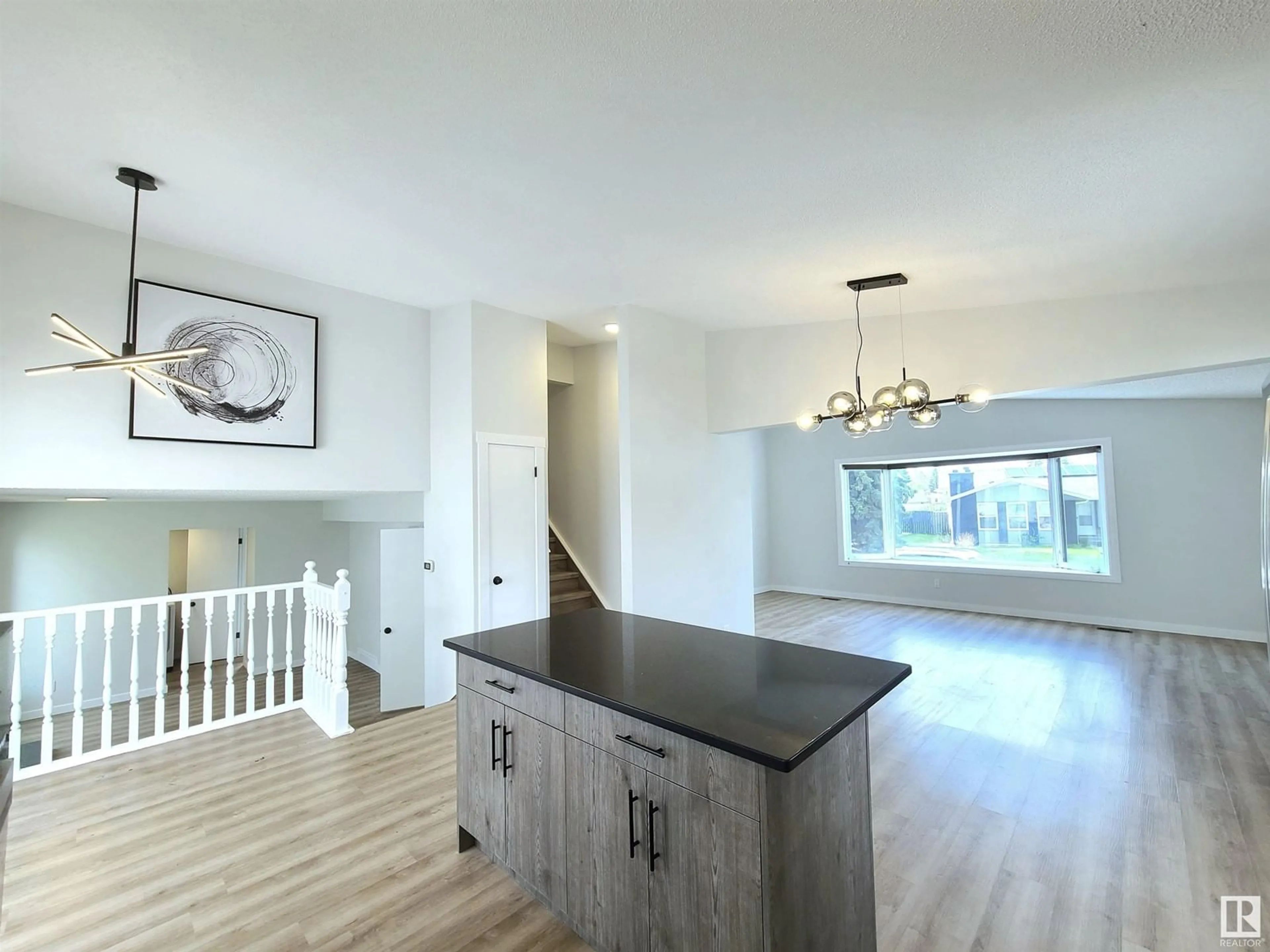 Open concept kitchen, wood/laminate floor for 16307 112 ST NW, Edmonton Alberta T5X2B2