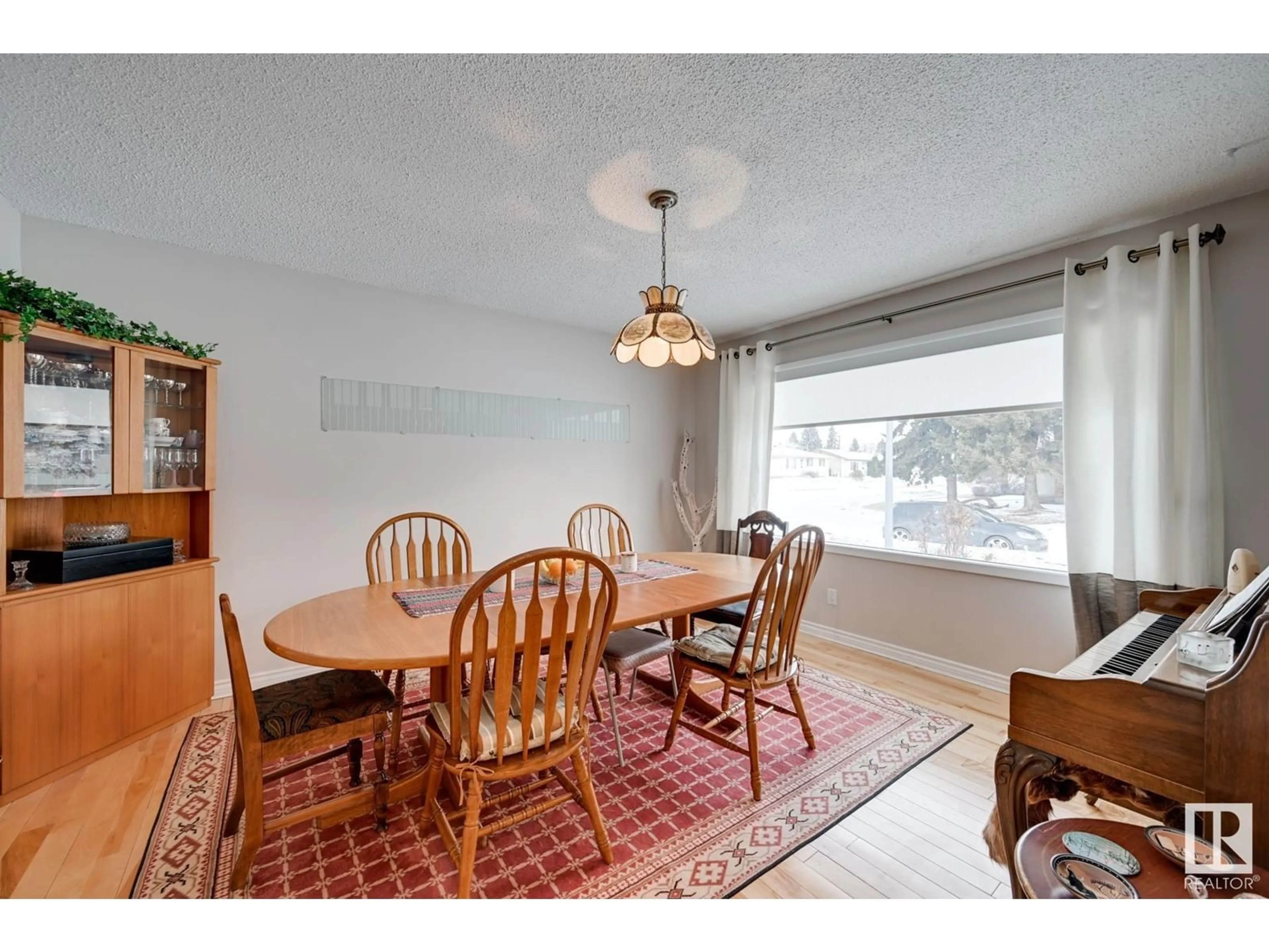 Dining room, wood/laminate floor for 7047 132A AV, Edmonton Alberta T5C2B8