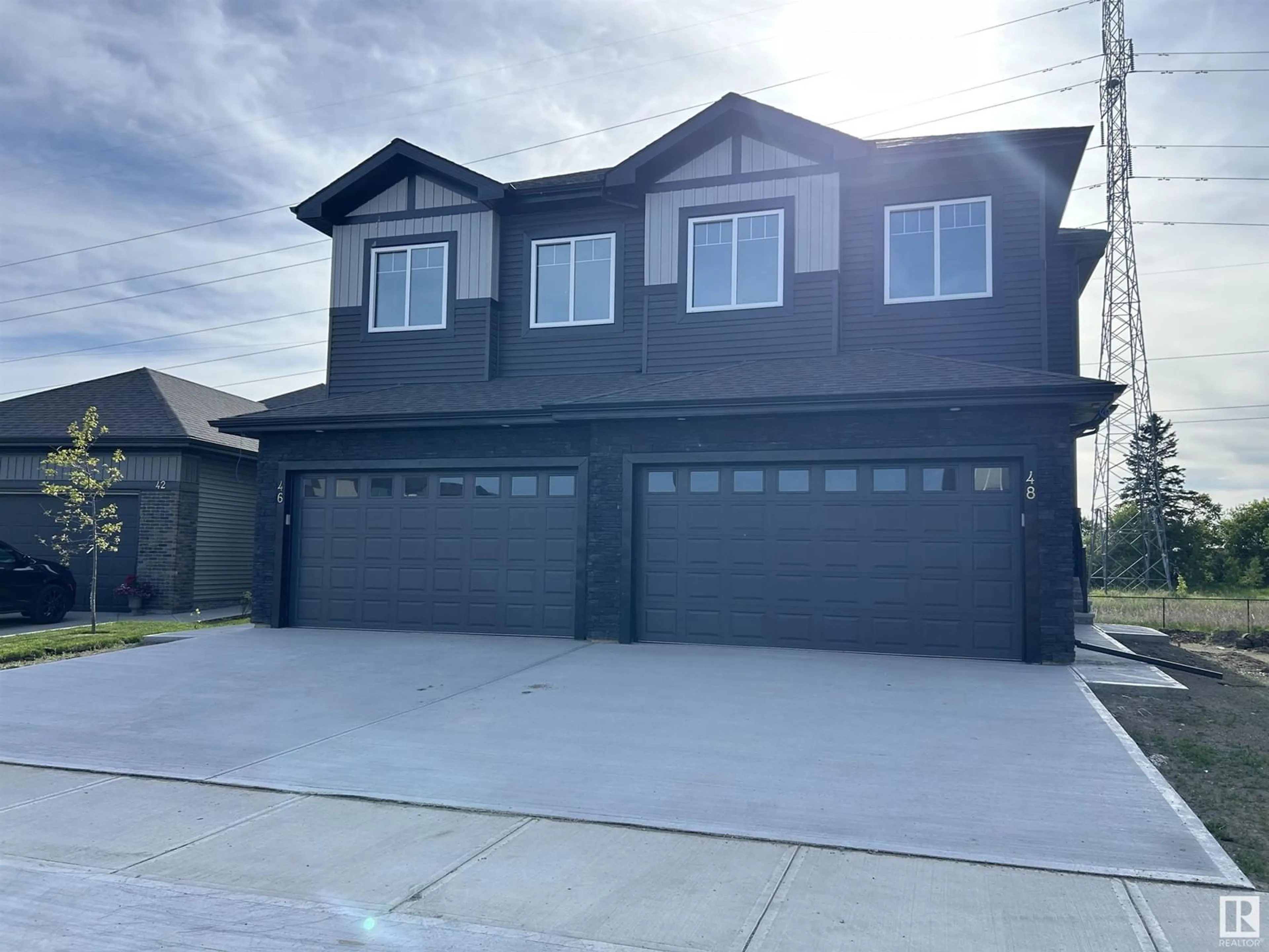 Home with vinyl exterior material, street for 48 WAVERLY WY, Fort Saskatchewan Alberta T8L3L7