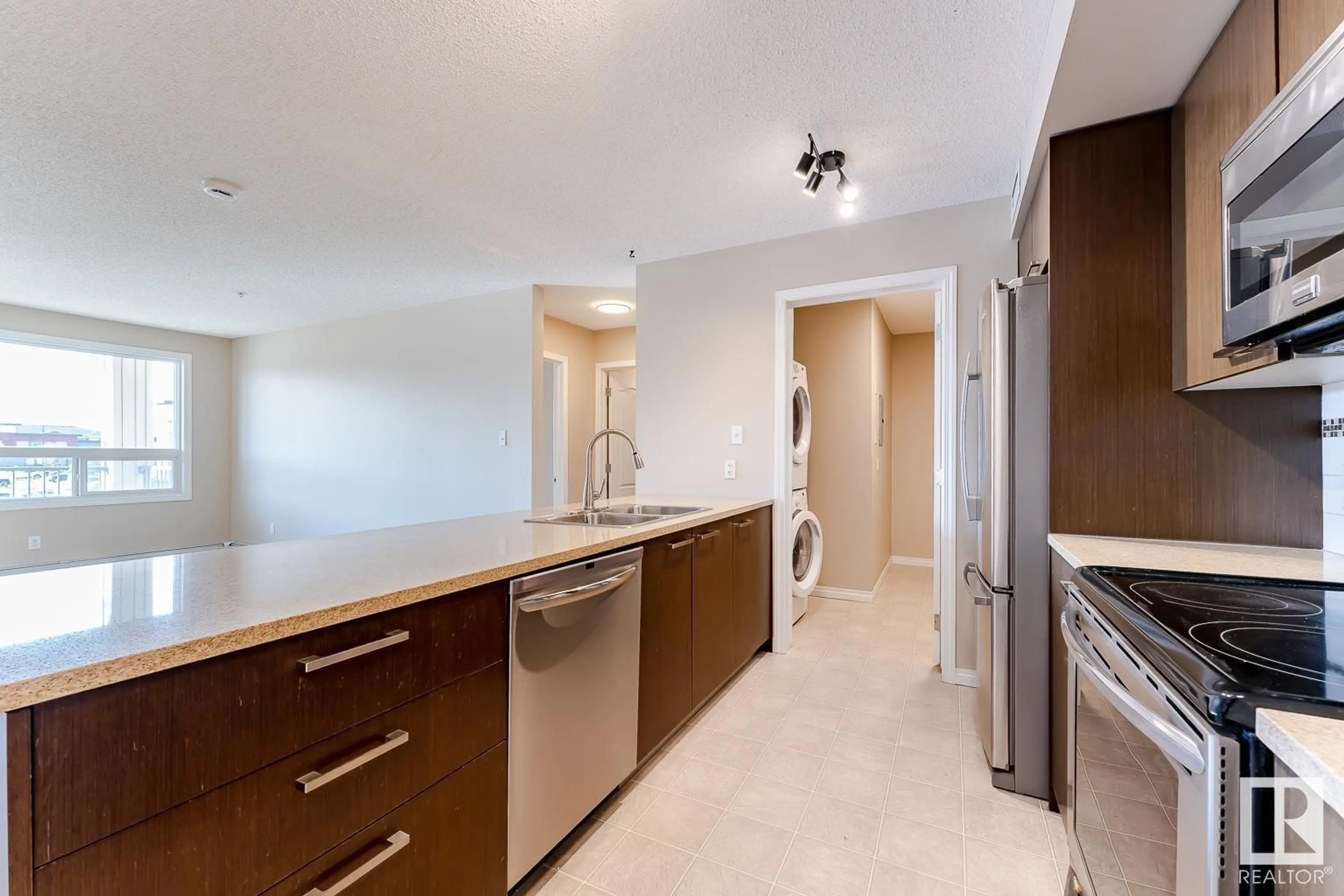Kitchen with laundary machines, unknown for 2205 TEWILLEGAR DR, Edmonton Alberta T6R0M2