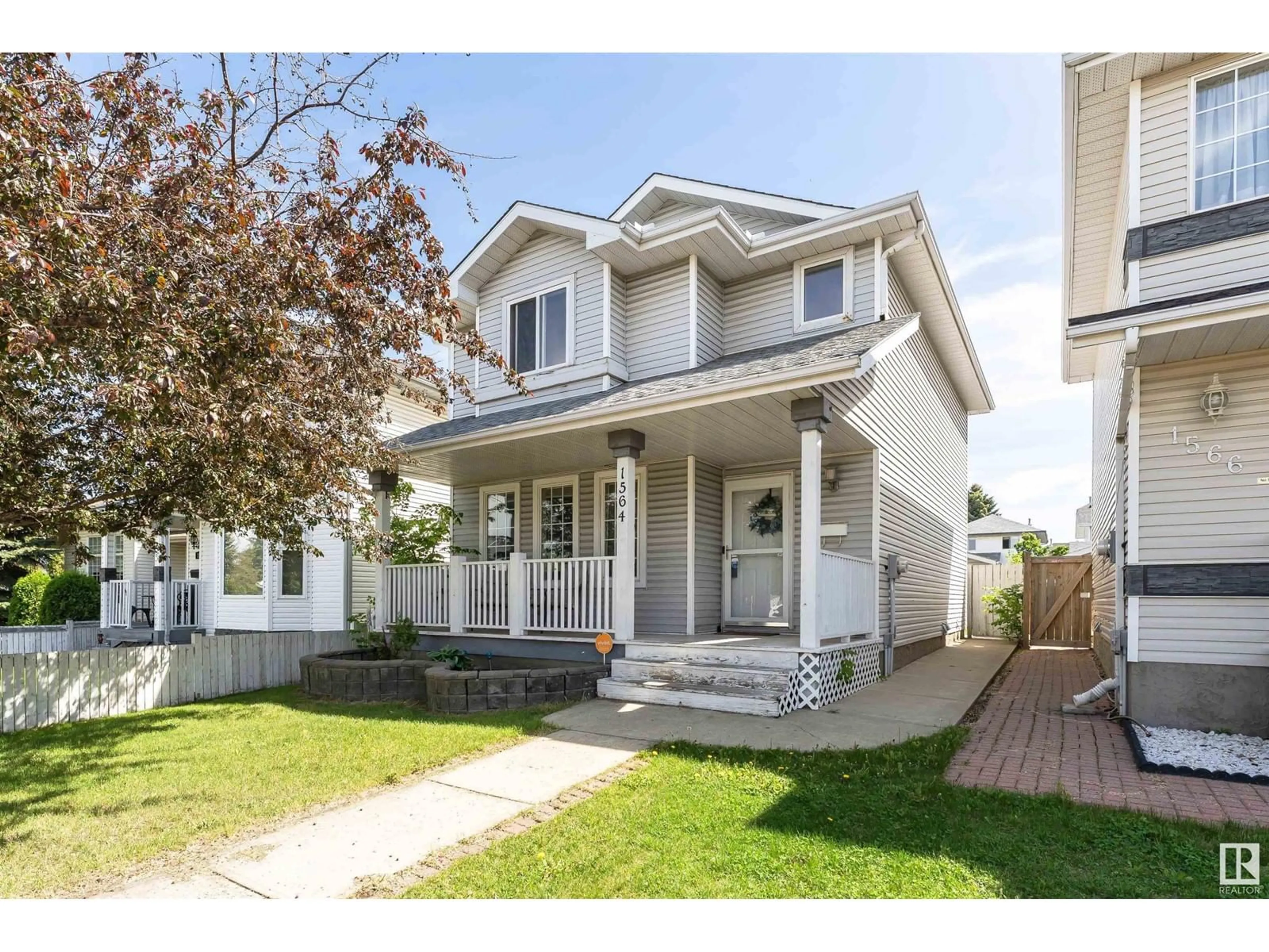 Home with vinyl exterior material, street for 1564 JARVIS CR, Edmonton Alberta T6L6S3