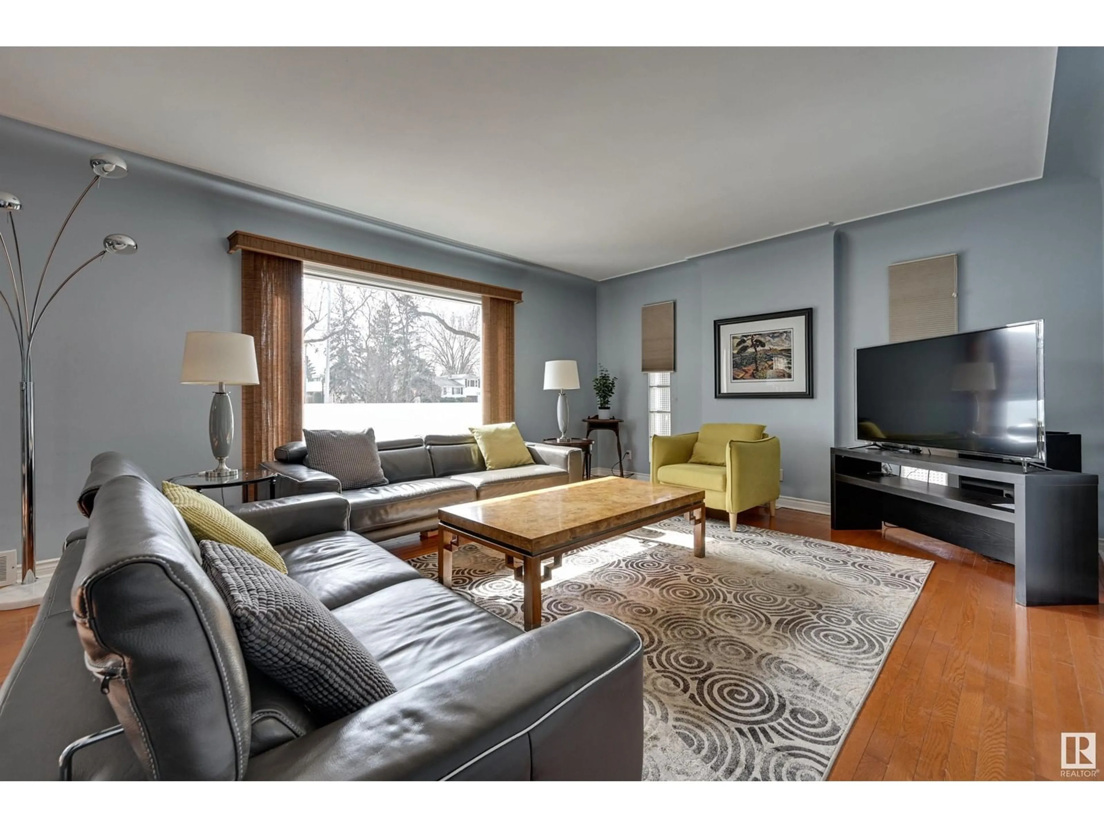 Living room with furniture, wood/laminate floor for NW - 10205 137 ST, Edmonton Alberta T5N2G8