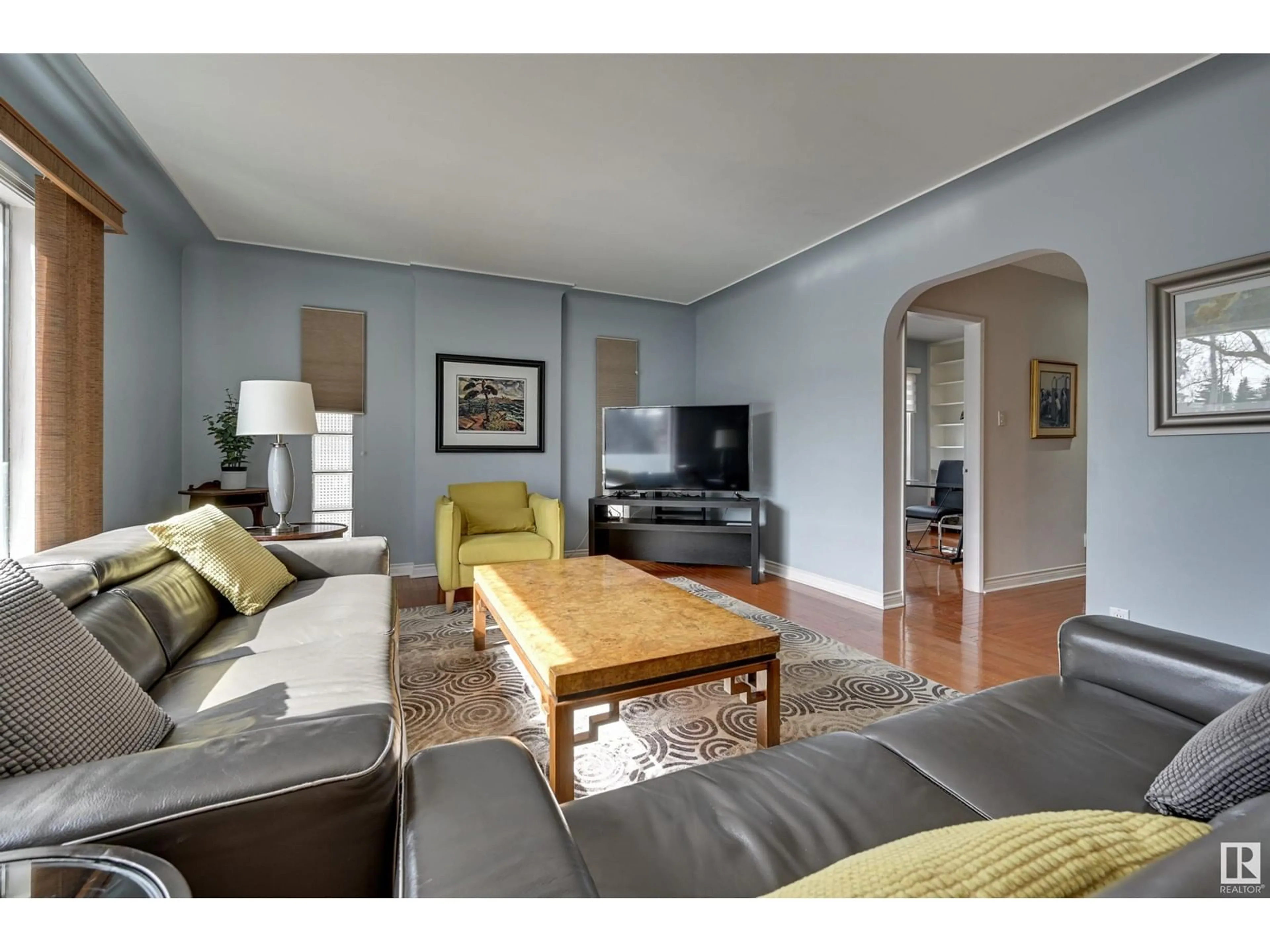 Living room with furniture, wood/laminate floor for NW - 10205 137 ST, Edmonton Alberta T5N2G8