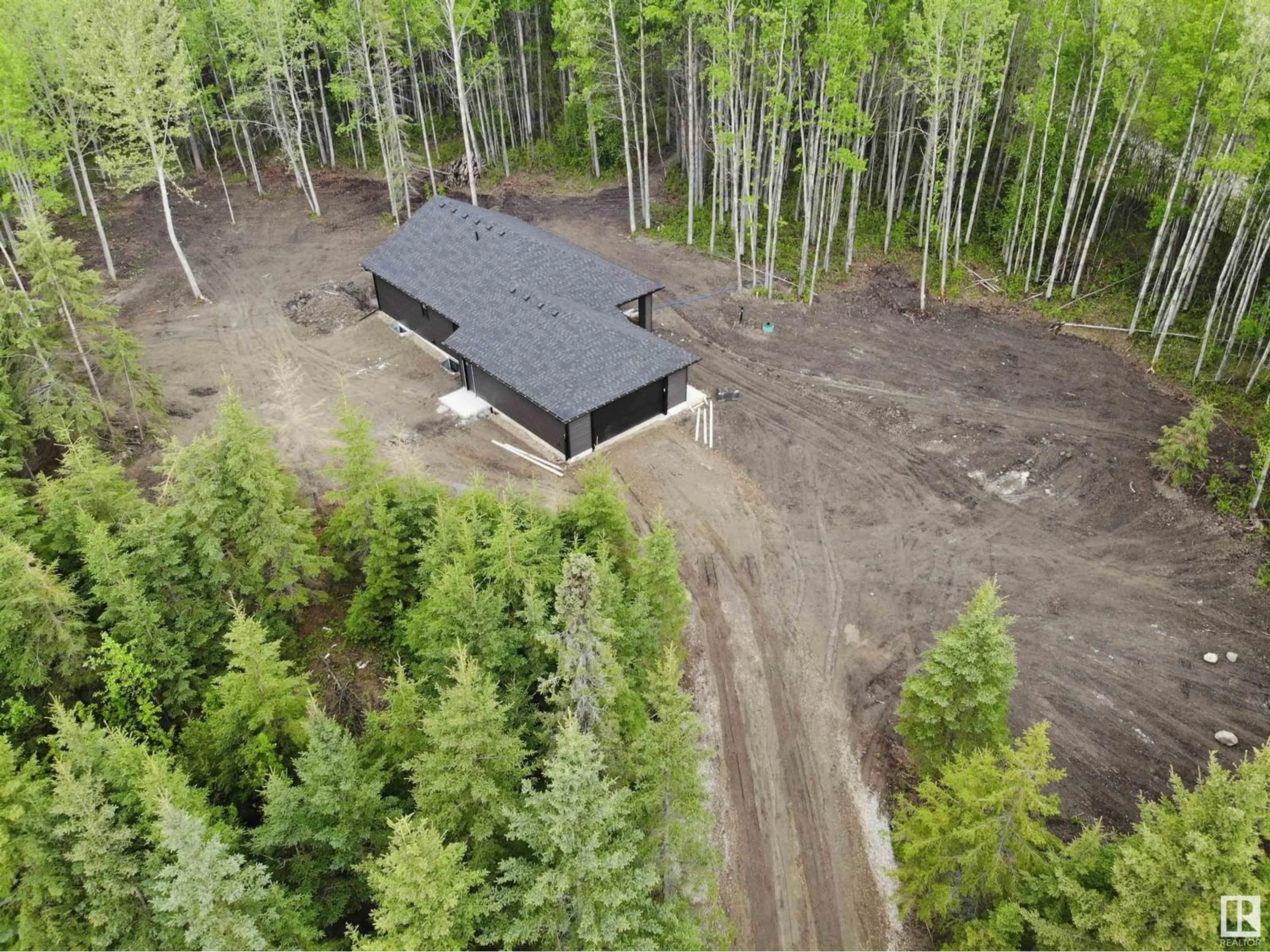 A pic from outside/outdoor area/front of a property/back of a property/a pic from drone, forest/trees view for 37 - 420 1414 HWY, Rural Lac Ste. Anne County Alberta T5A1H3