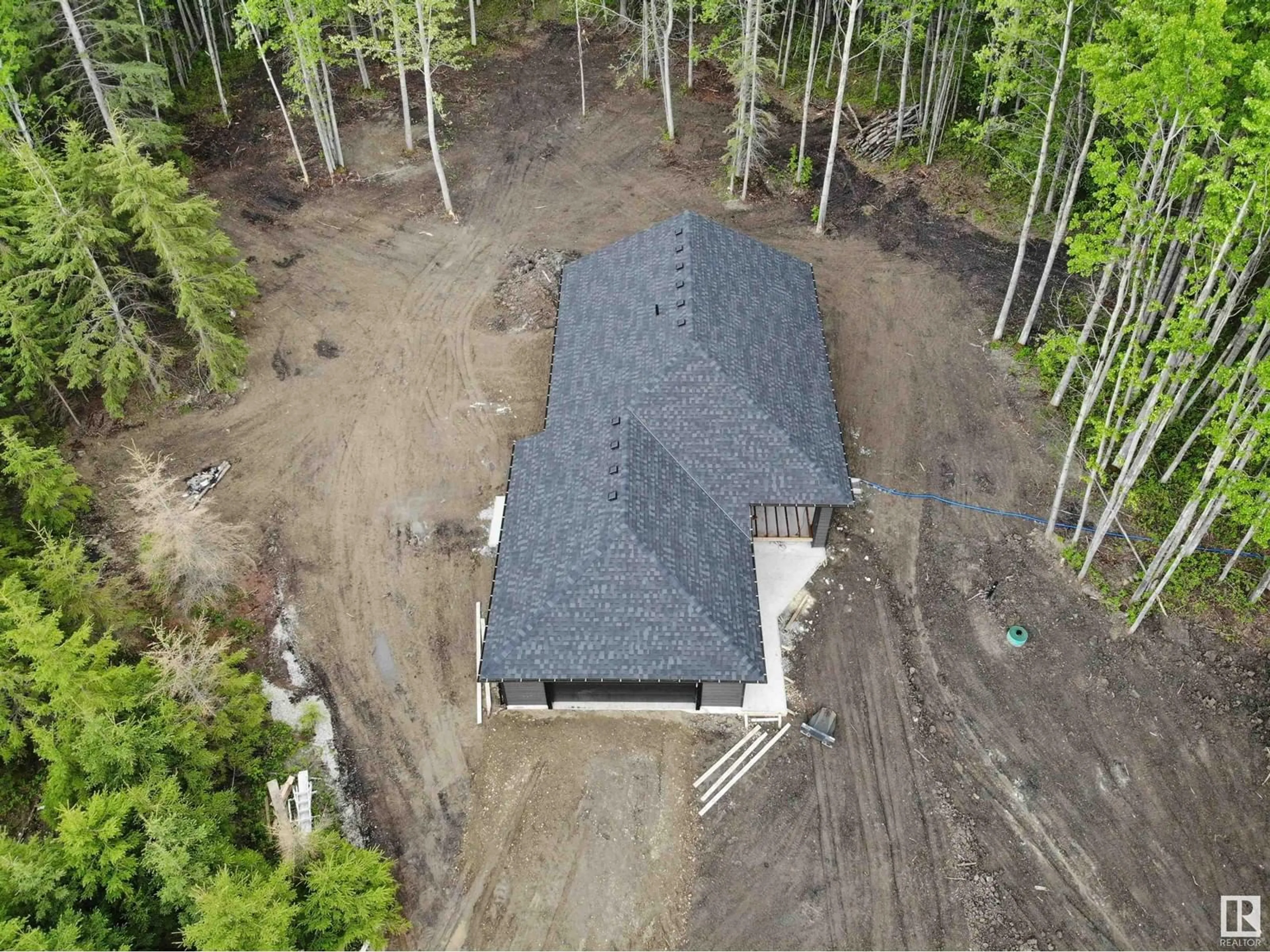 A pic from outside/outdoor area/front of a property/back of a property/a pic from drone, forest/trees view for 37 - 420 1414 HWY, Rural Lac Ste. Anne County Alberta T5A1H3