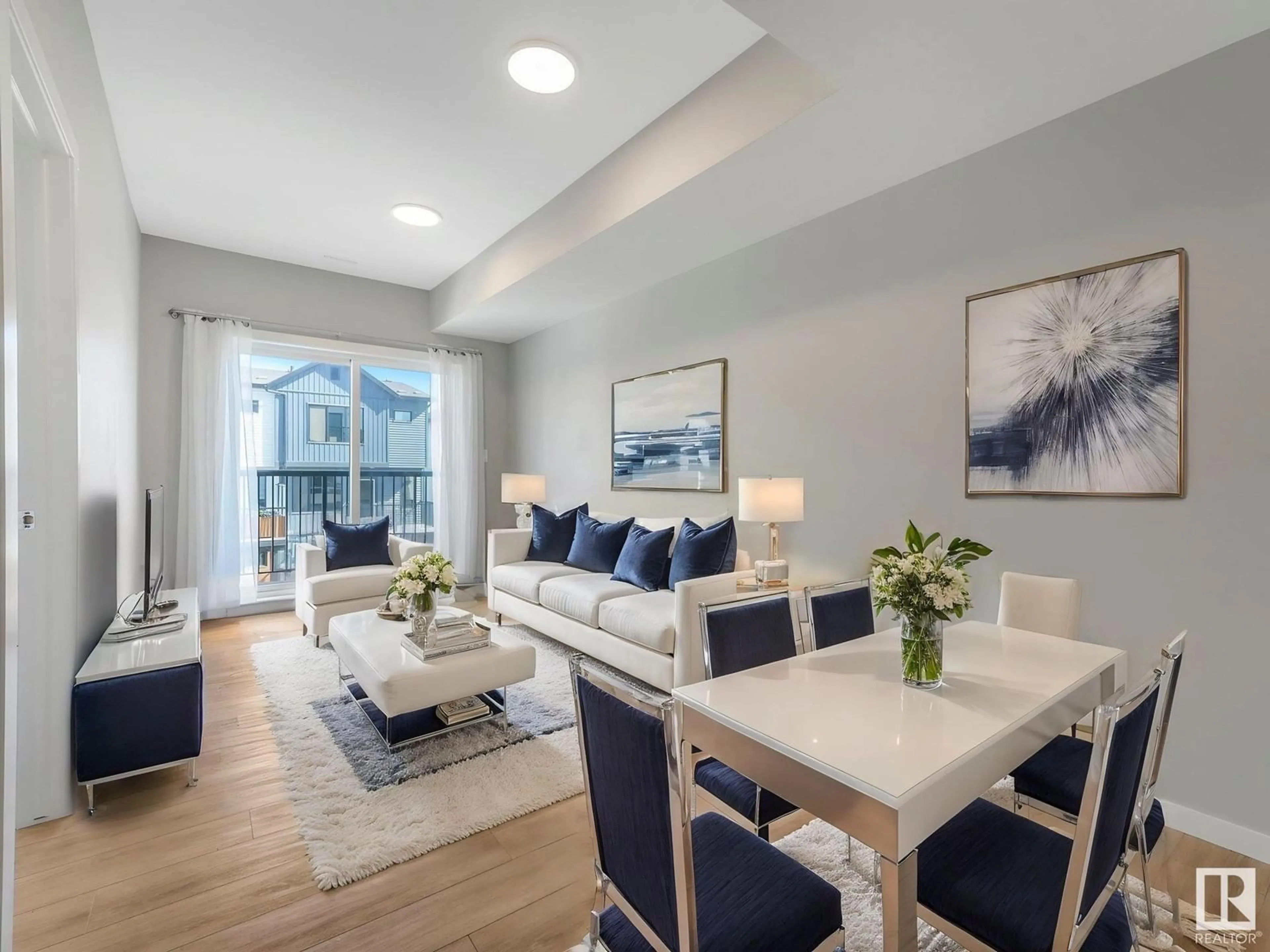 Living room with furniture, wood/laminate floor for 202 - 856 SECORD BV, Edmonton Alberta T5T7R9