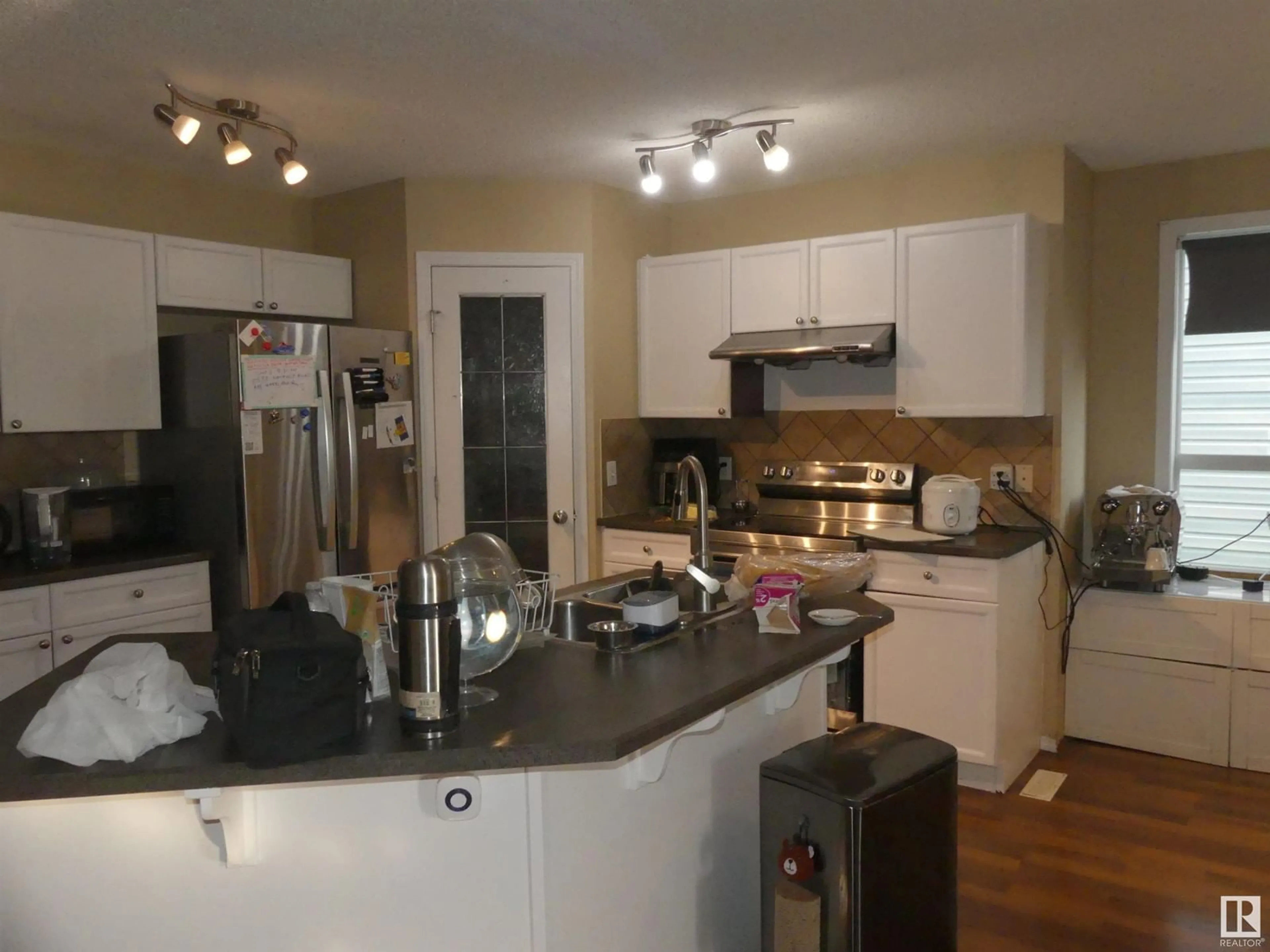 Open concept kitchen, wood/laminate floor for NW - 15930 139 ST, Edmonton Alberta T6V1S6