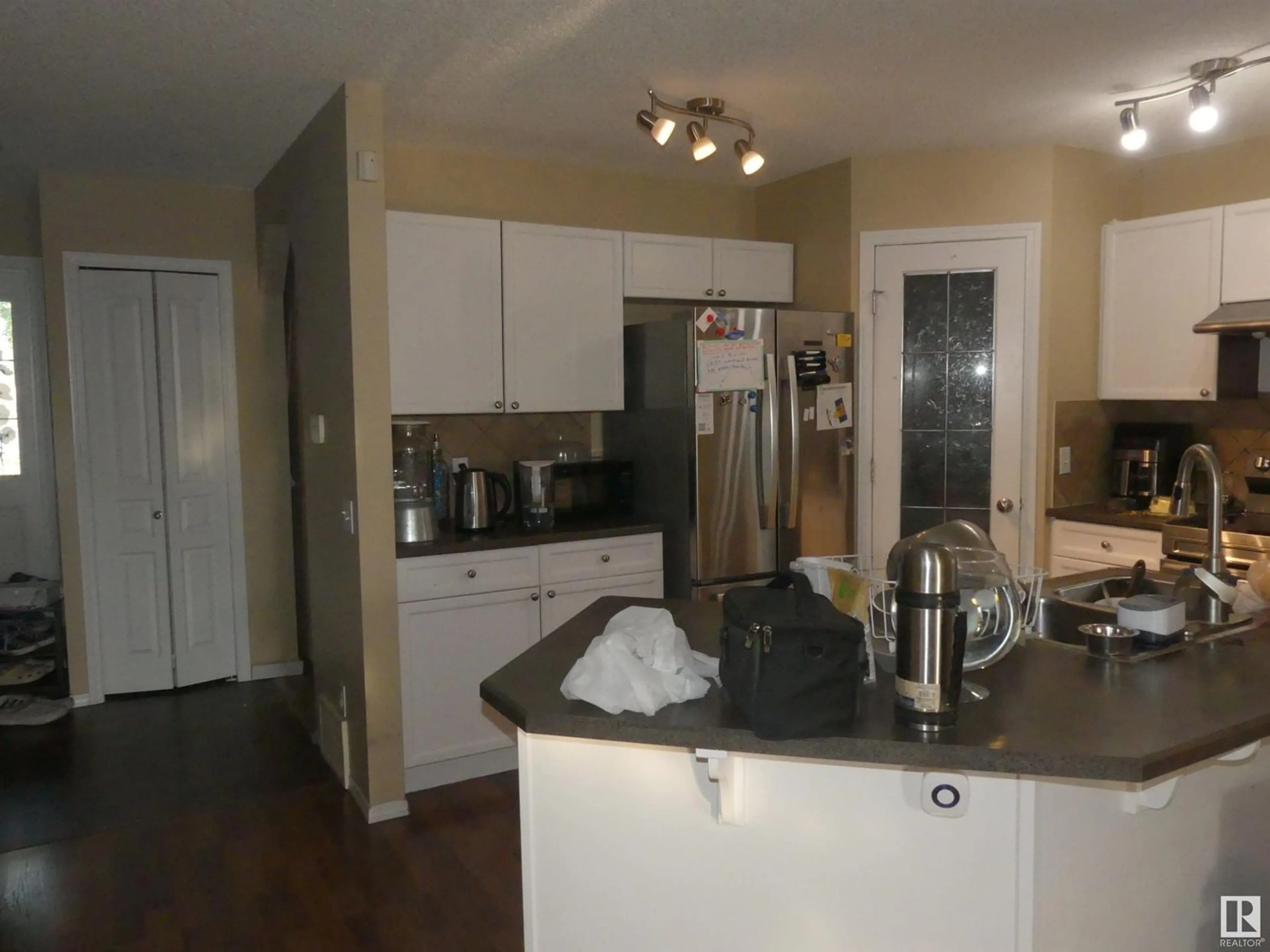 Open concept kitchen, wood/laminate floor for NW - 15930 139 ST, Edmonton Alberta T6V1S6