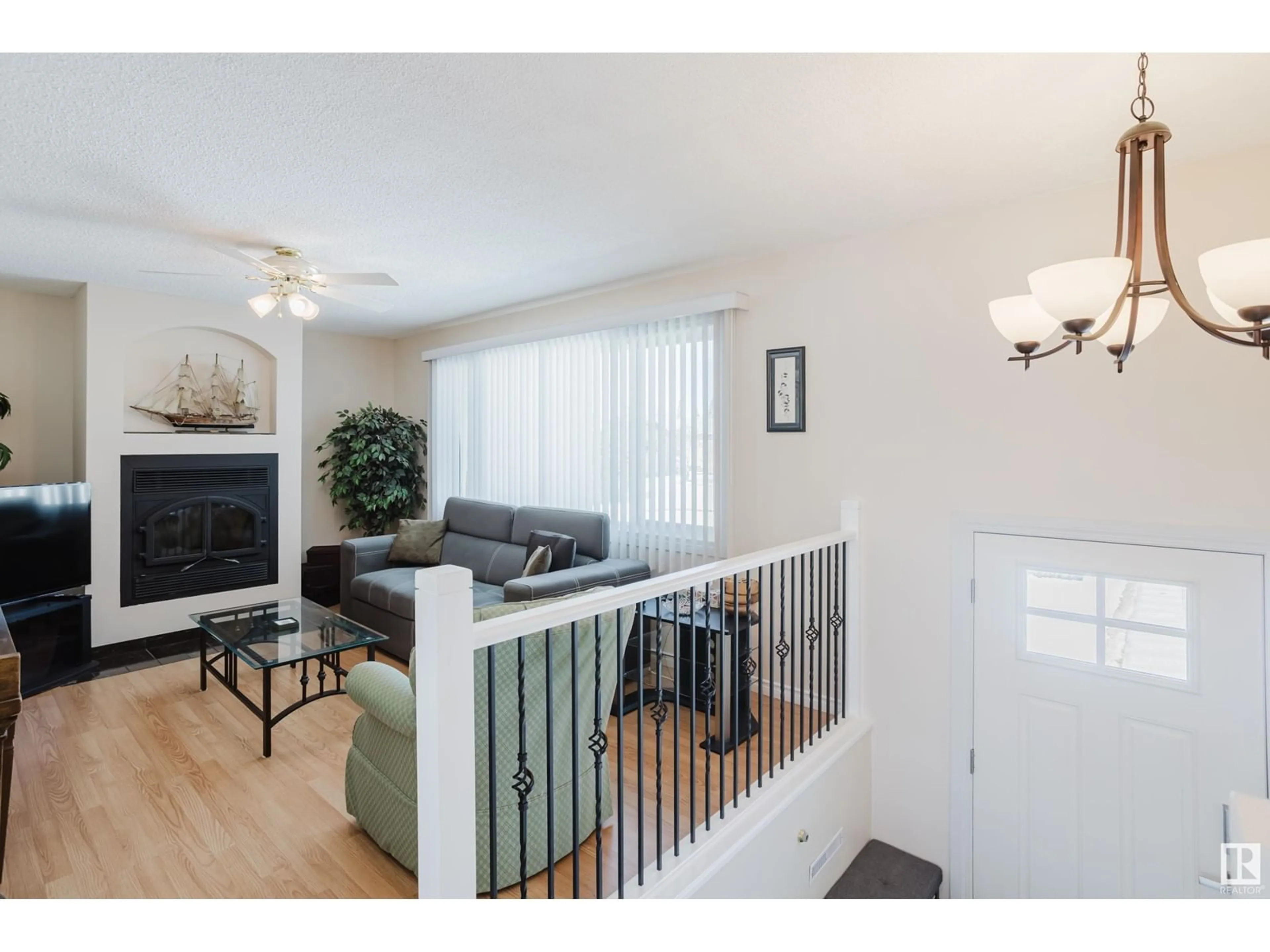 Living room with furniture, wood/laminate floor for NW - 9539 133 AV, Edmonton Alberta T5E1C7