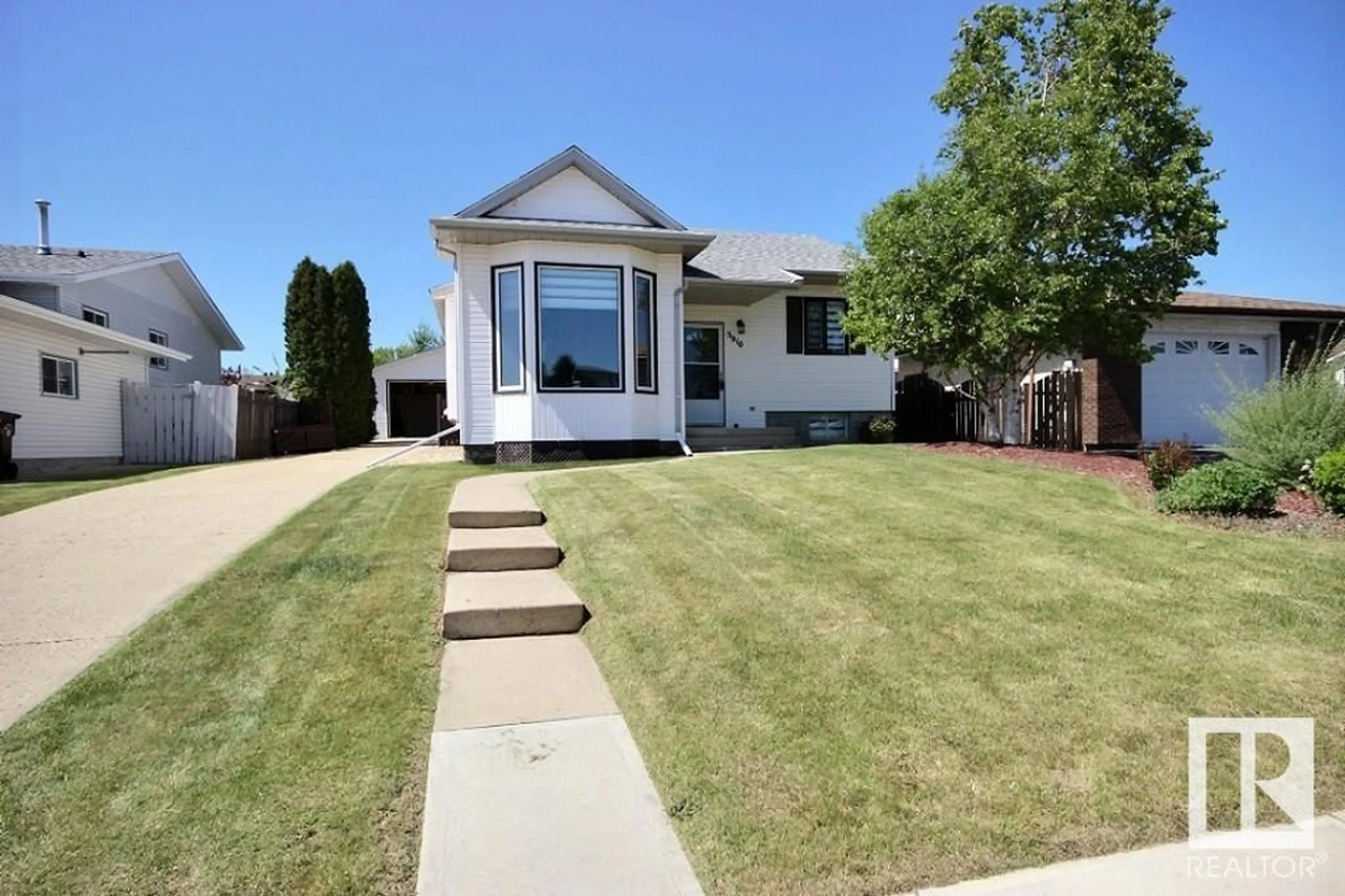 Home with vinyl exterior material, street for 5910 55 ST, Barrhead Alberta T7N1E1