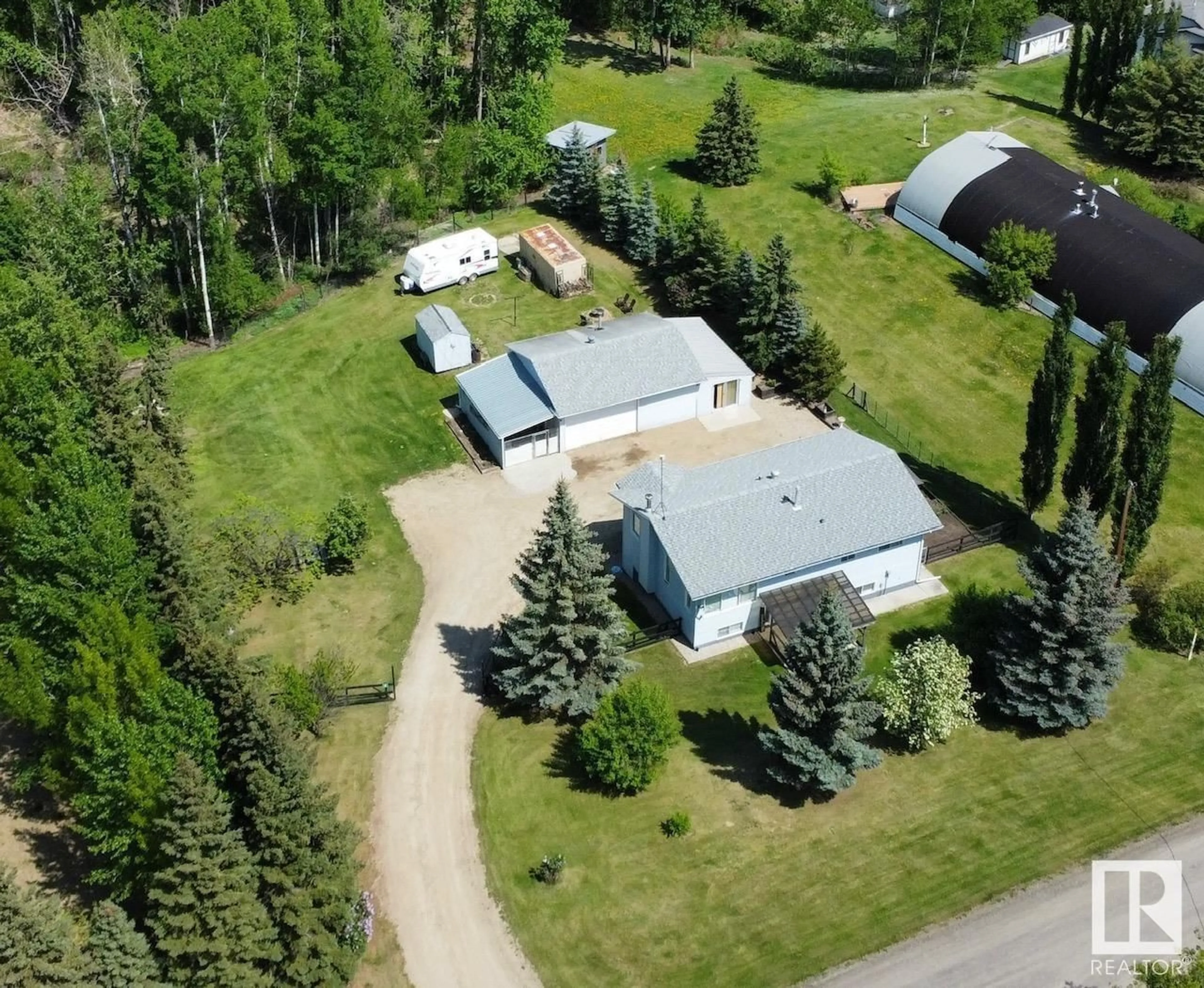 A pic from outside/outdoor area/front of a property/back of a property/a pic from drone, street for #4 - 2228 PARKLAND DR, Rural Parkland County Alberta T7Y2L2