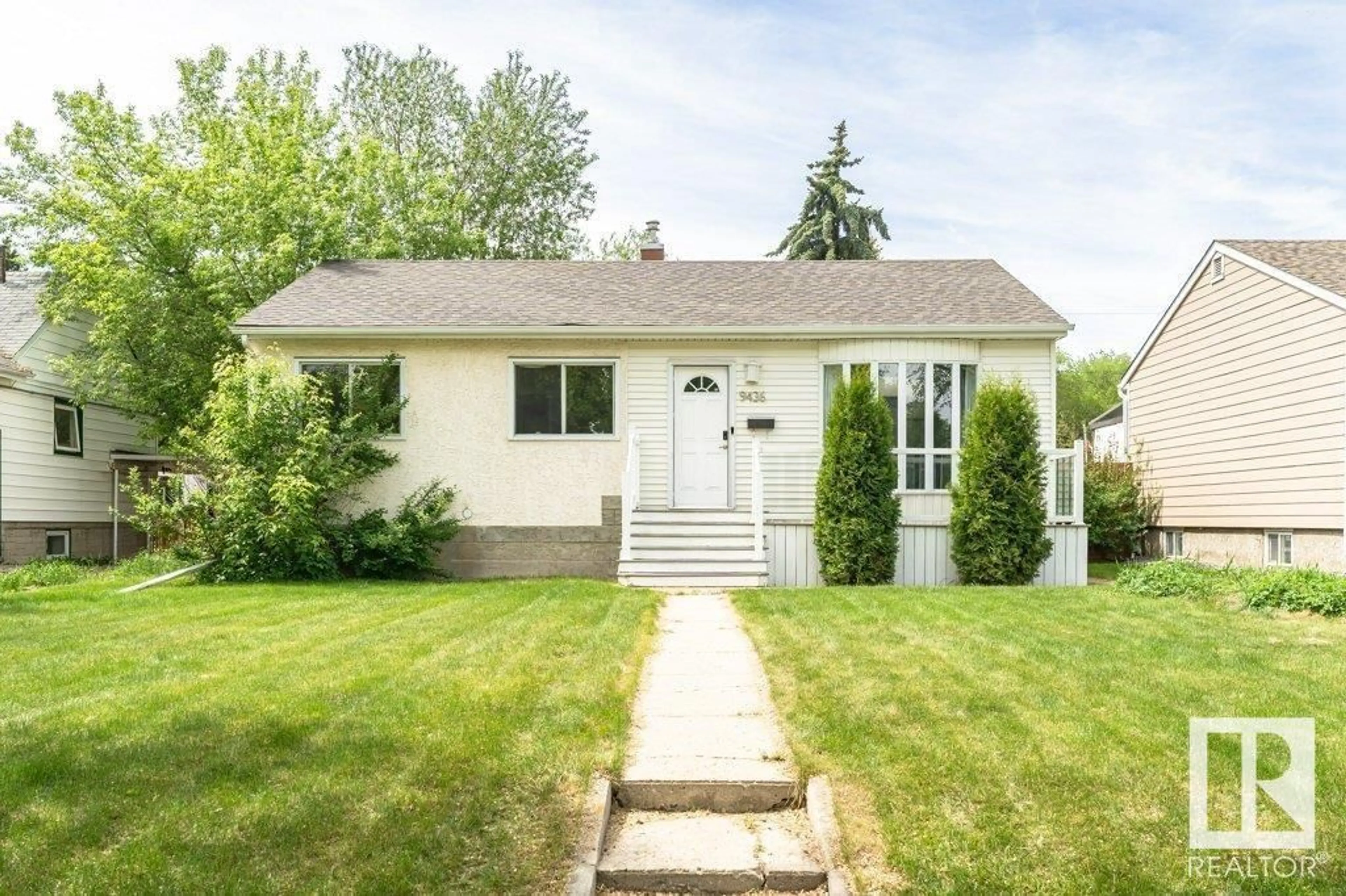 Home with vinyl exterior material, street for 9436 76 ST, Edmonton Alberta T6C2K6