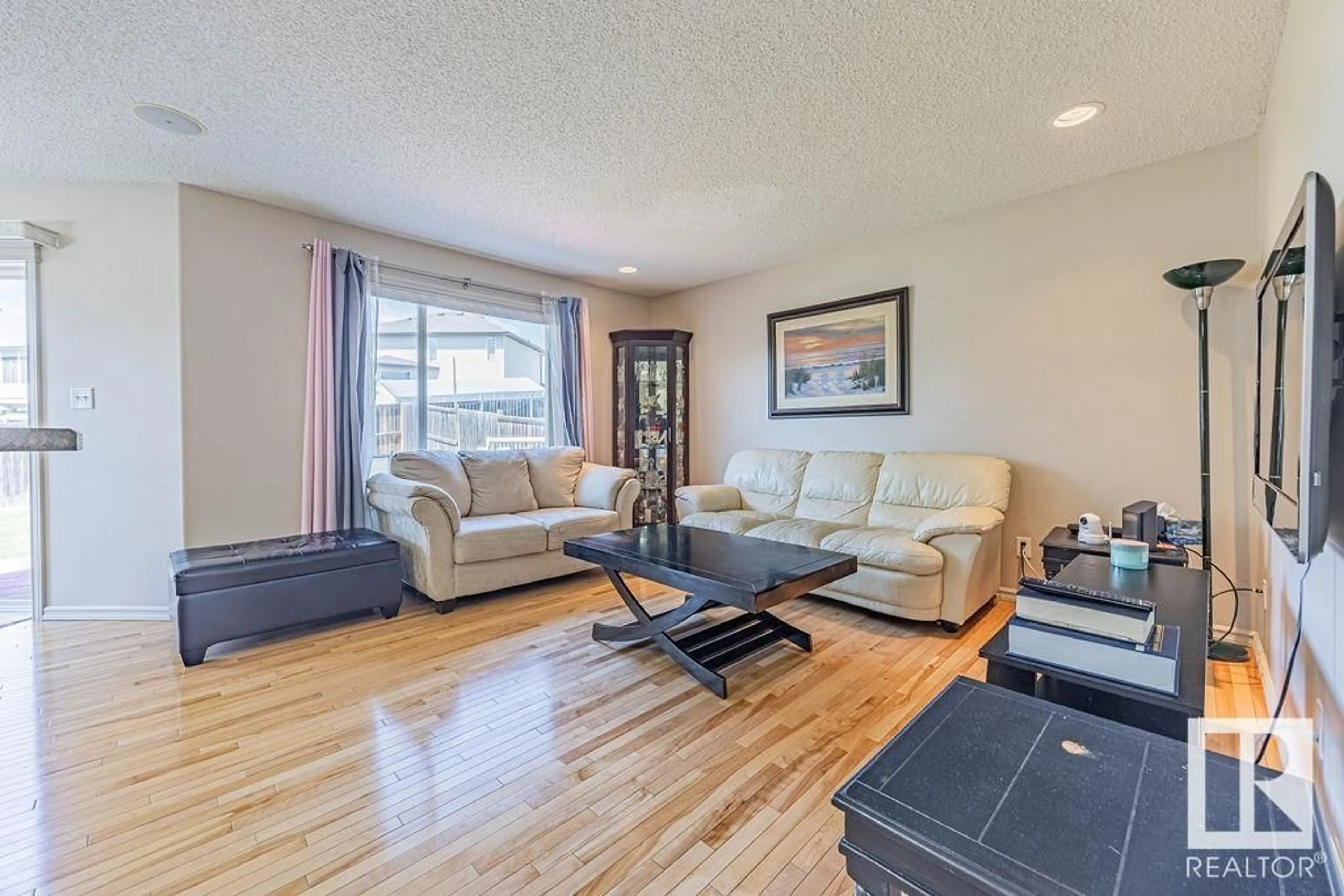 Living room with furniture, wood/laminate floor for NW - 17316 85 ST, Edmonton Alberta T5Z3W3
