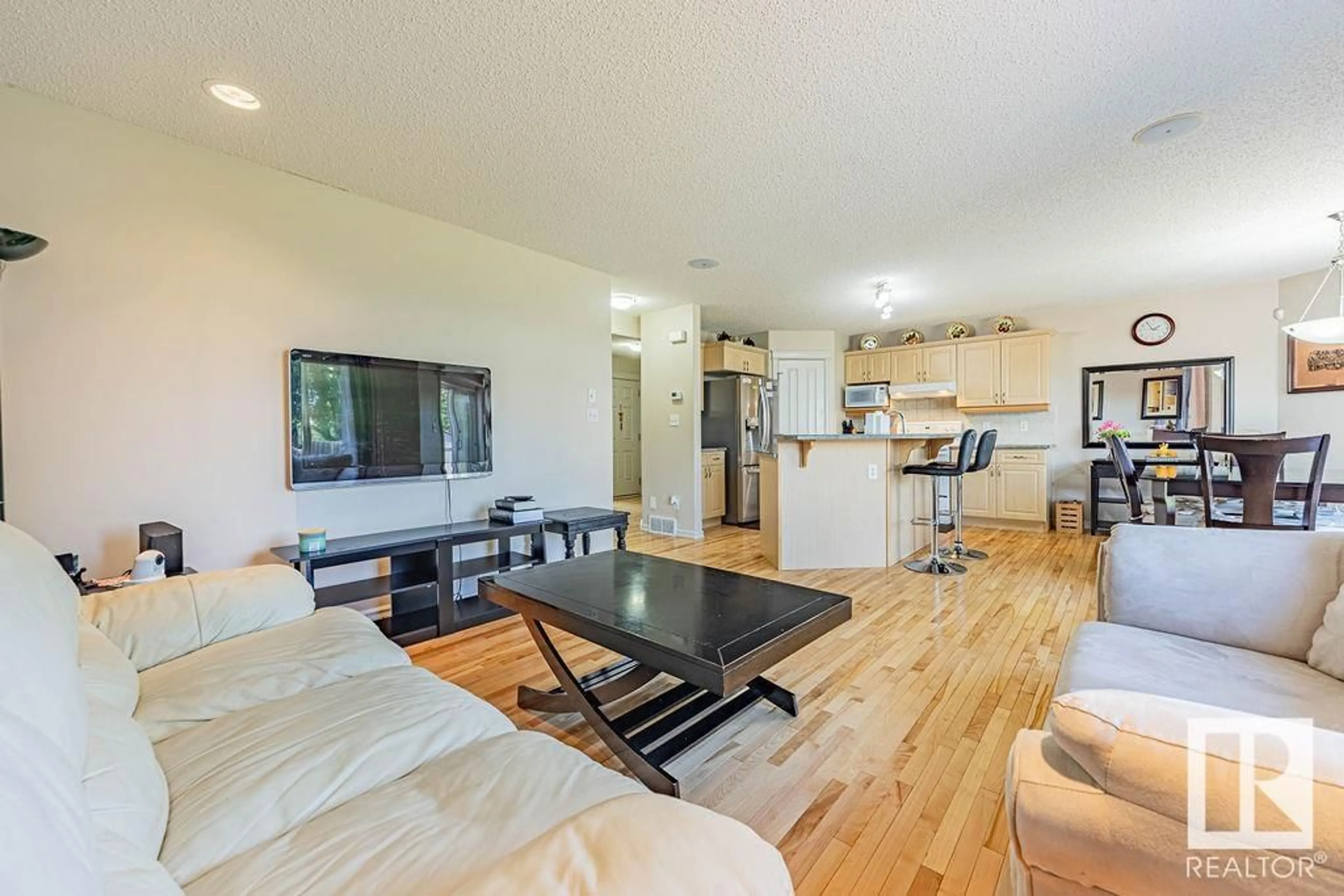 Living room with furniture, wood/laminate floor for NW - 17316 85 ST, Edmonton Alberta T5Z3W3