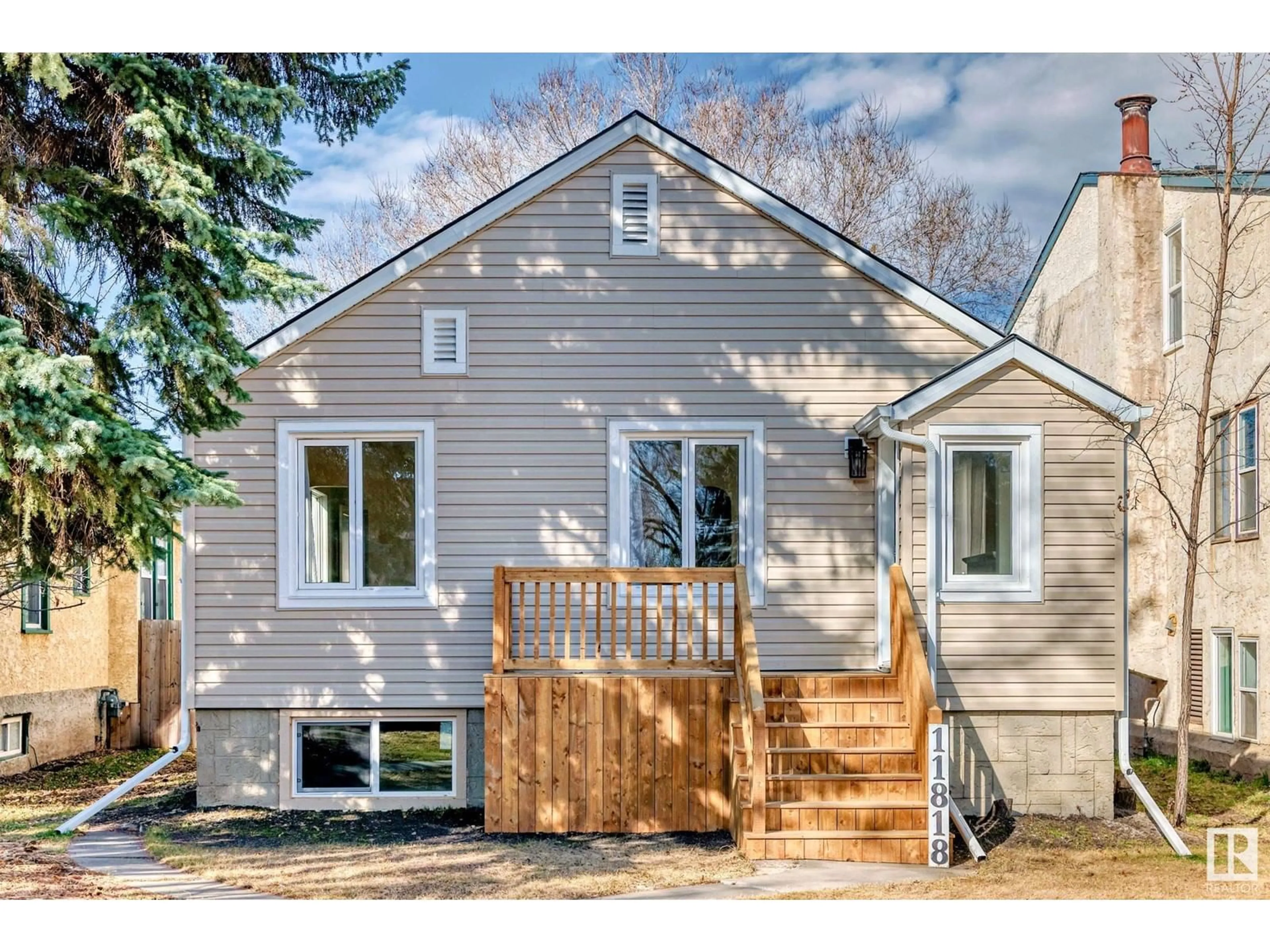Home with vinyl exterior material, street for NW - 11818 86 ST, Edmonton Alberta T5B3K1