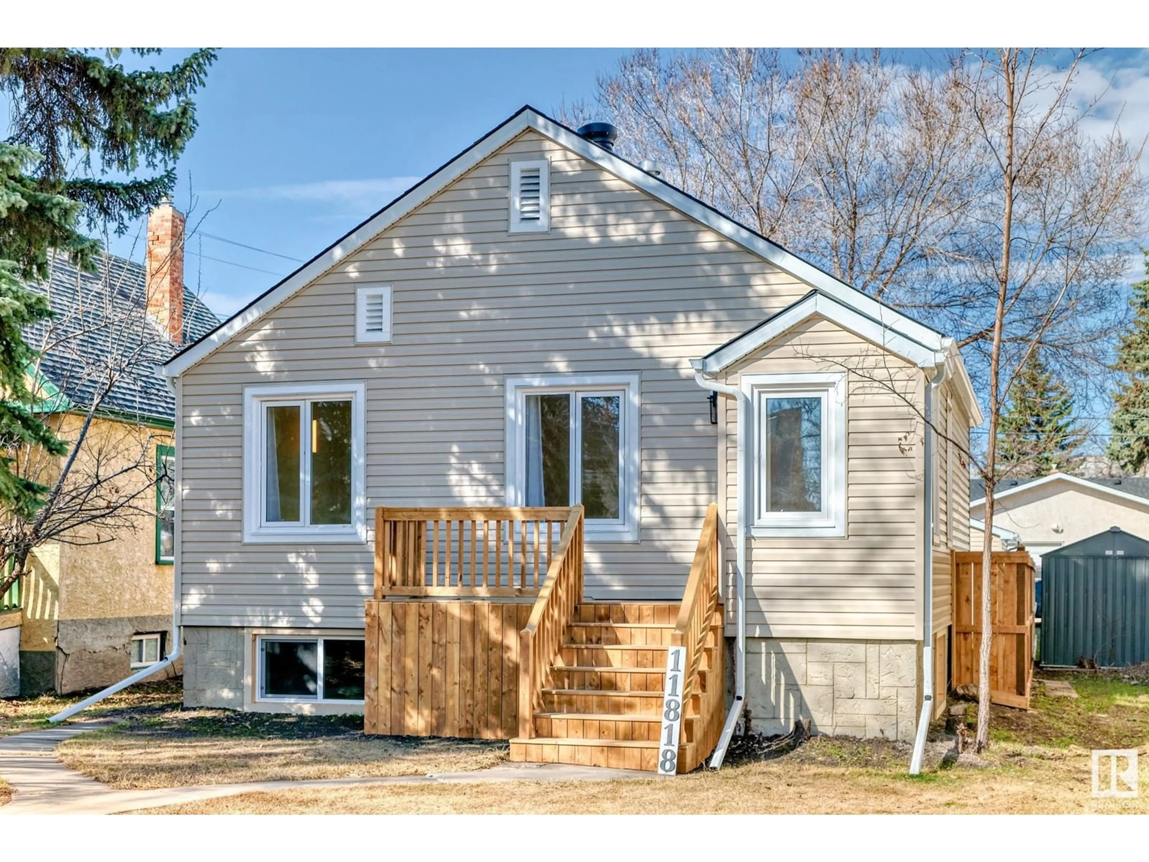 Home with vinyl exterior material, street for NW - 11818 86 ST, Edmonton Alberta T5B3K1