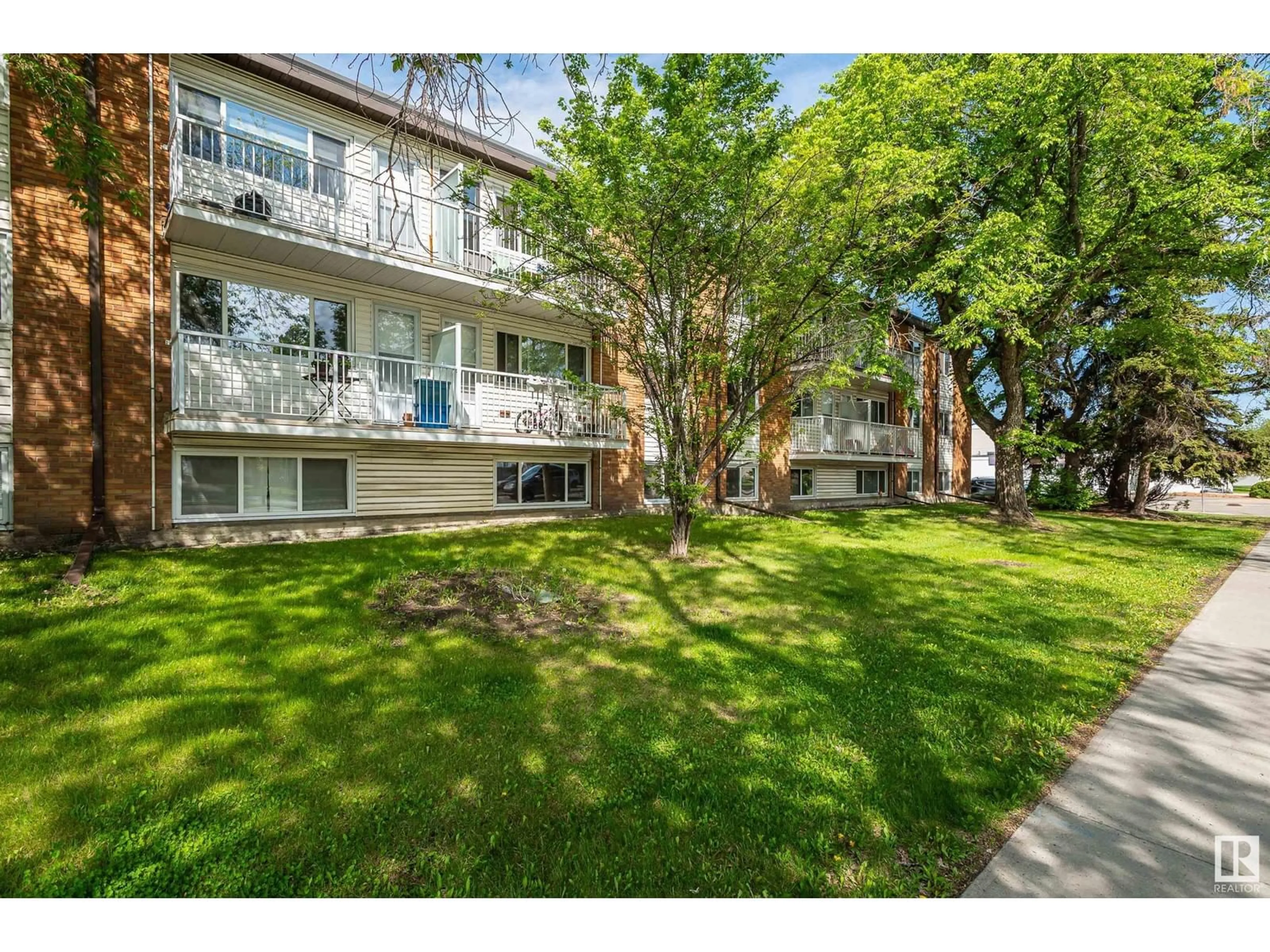 A pic from outside/outdoor area/front of a property/back of a property/a pic from drone, street for 302 - 14903 92 AV, Edmonton Alberta T5R5B5