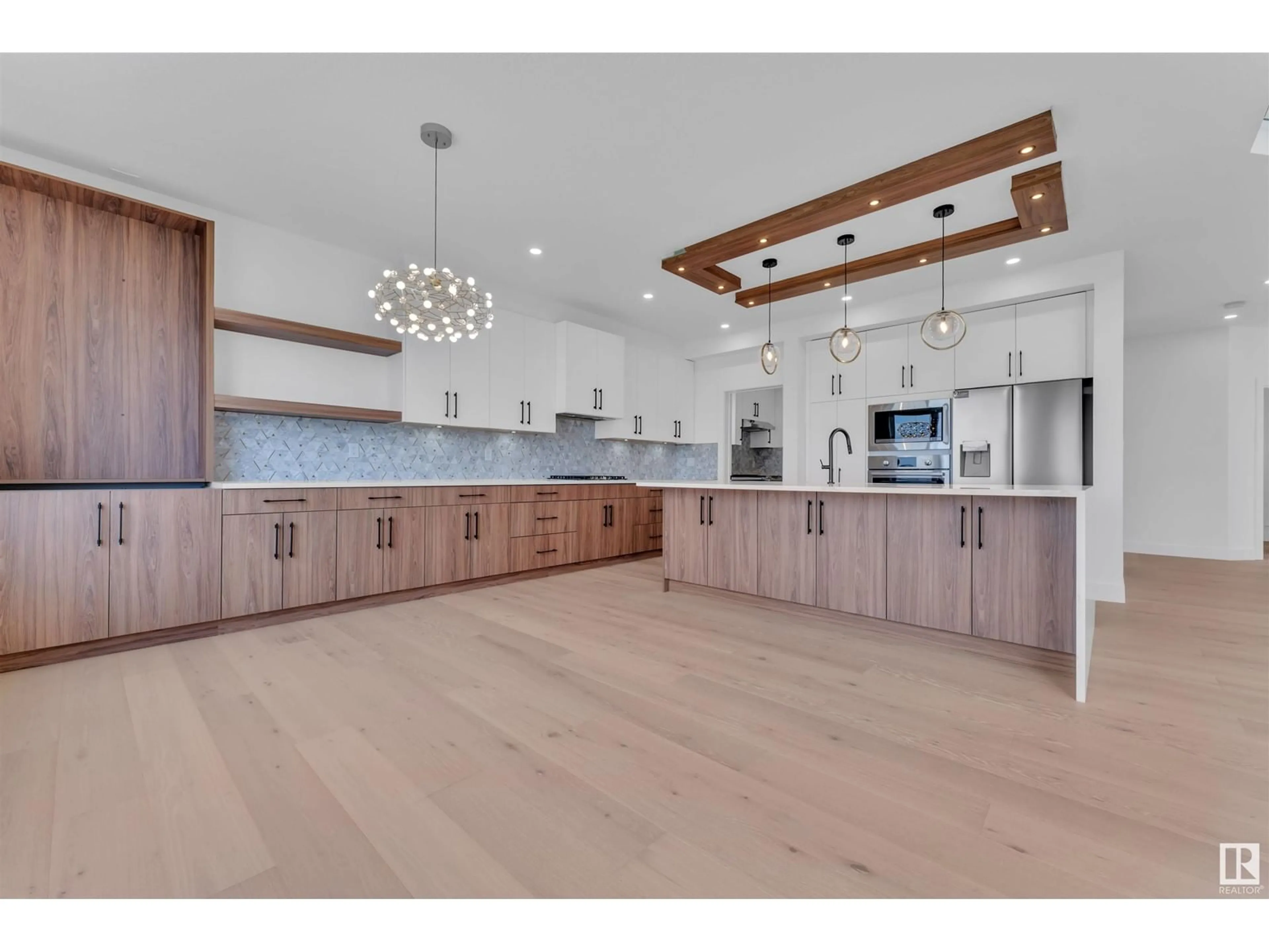 Open concept kitchen, wood/laminate floor for 324 ASTON CL, Leduc Alberta T9E1H9