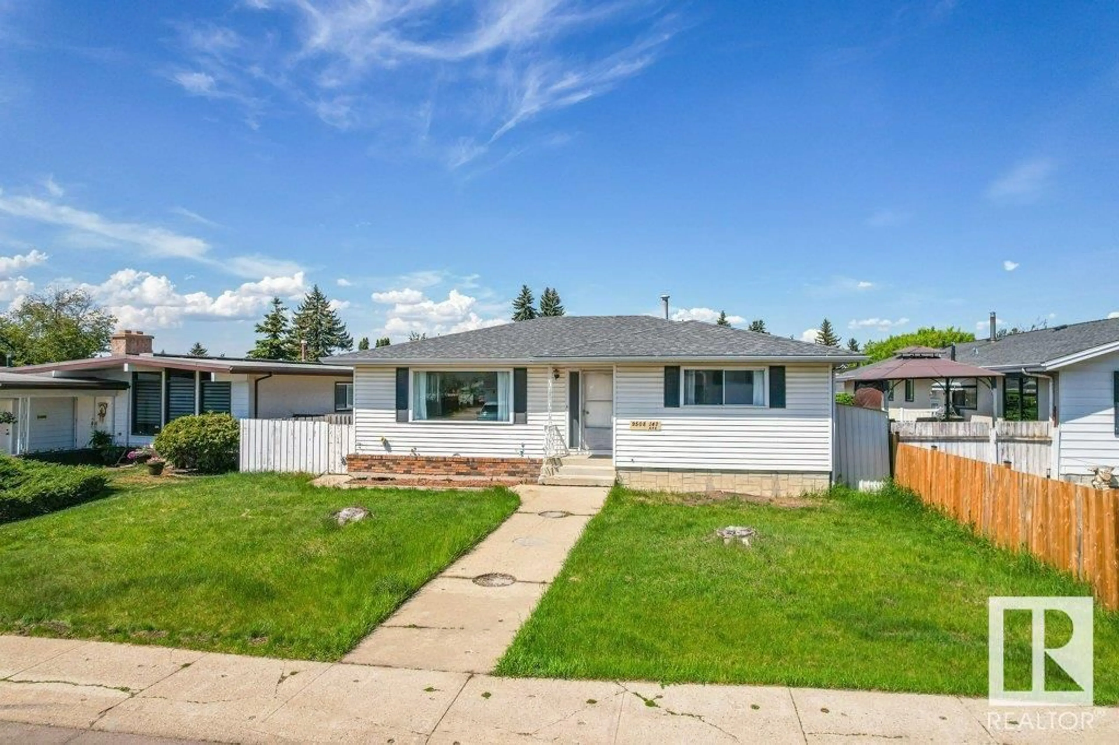 Home with vinyl exterior material, street for 9508 147 AV, Edmonton Alberta T5E2K6