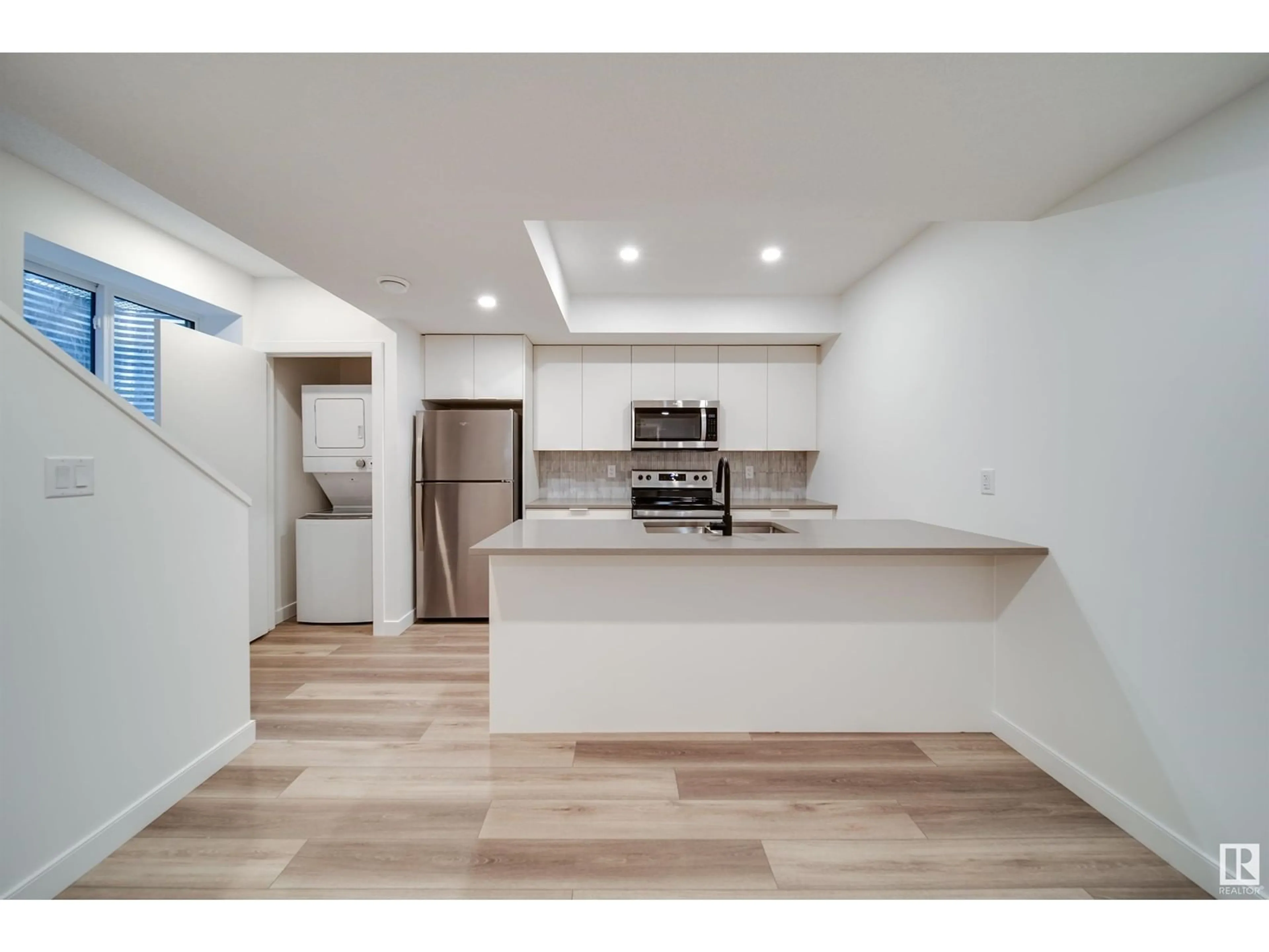 Open concept kitchen, unknown for 8522 80 AV NW, Edmonton Alberta T6C0W3