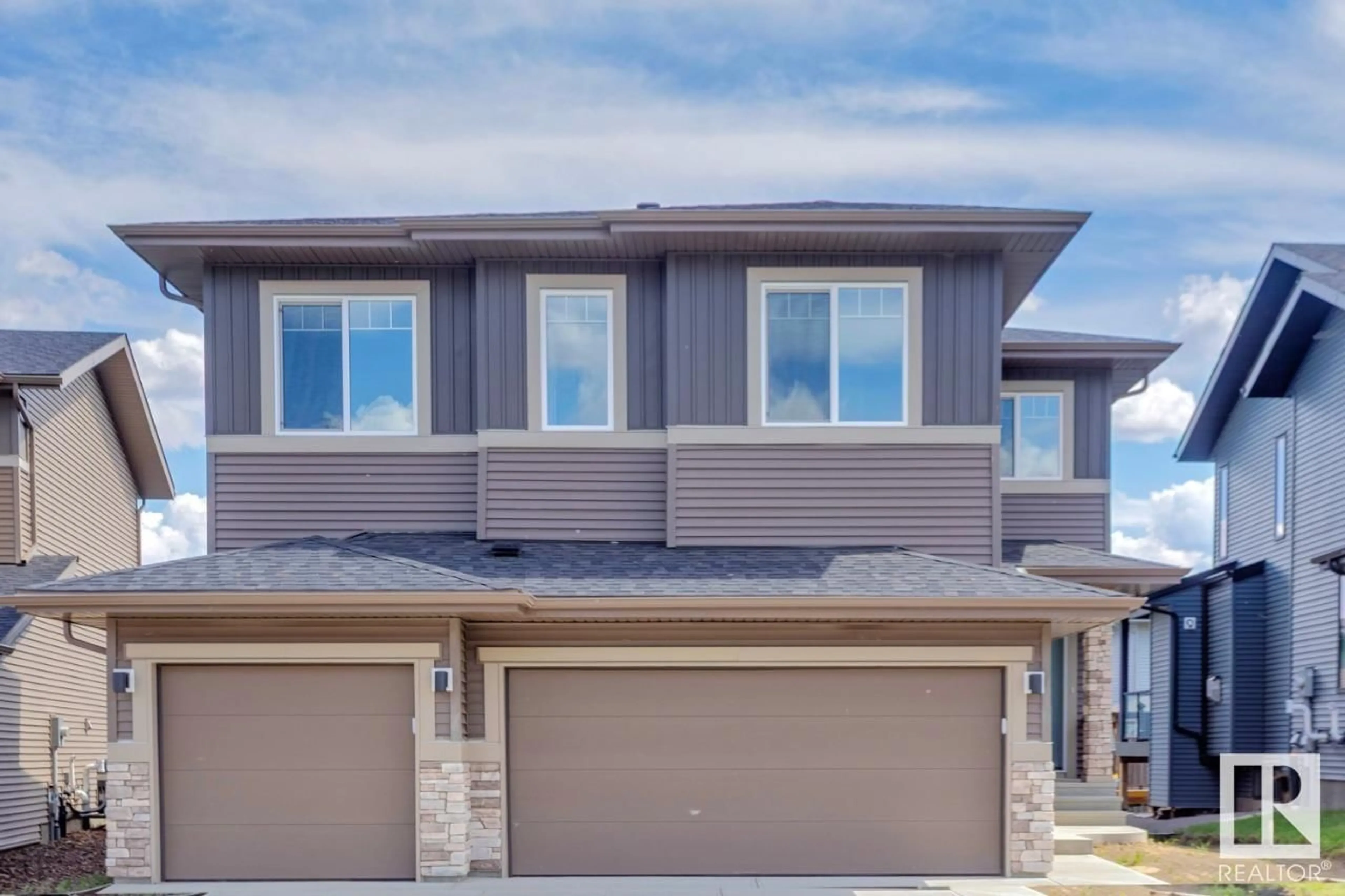 Home with vinyl exterior material, street for 20319 29 AV, Edmonton Alberta T6M0W5