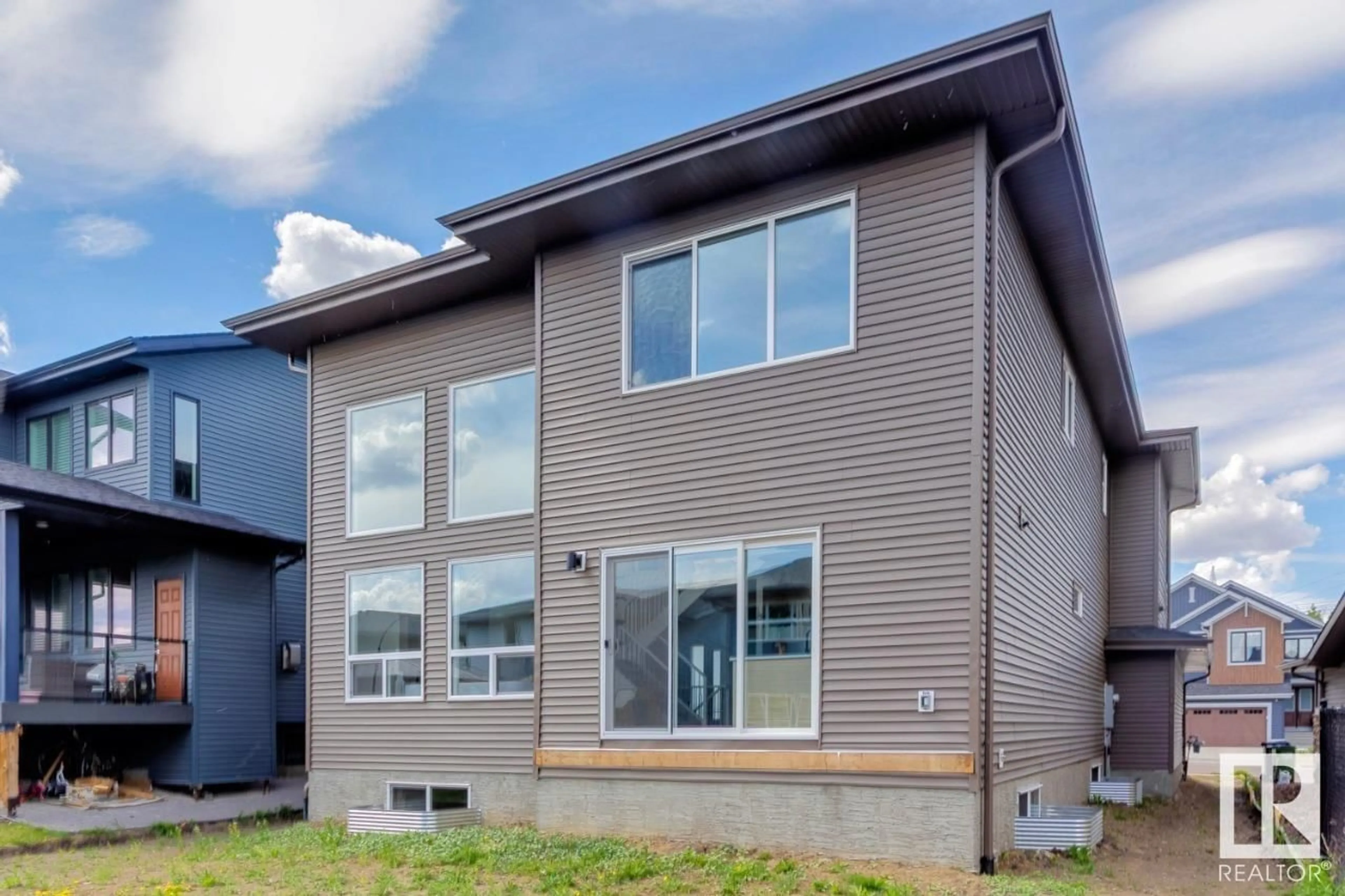 Home with vinyl exterior material, street for 20319 29 AV, Edmonton Alberta T6M0W5