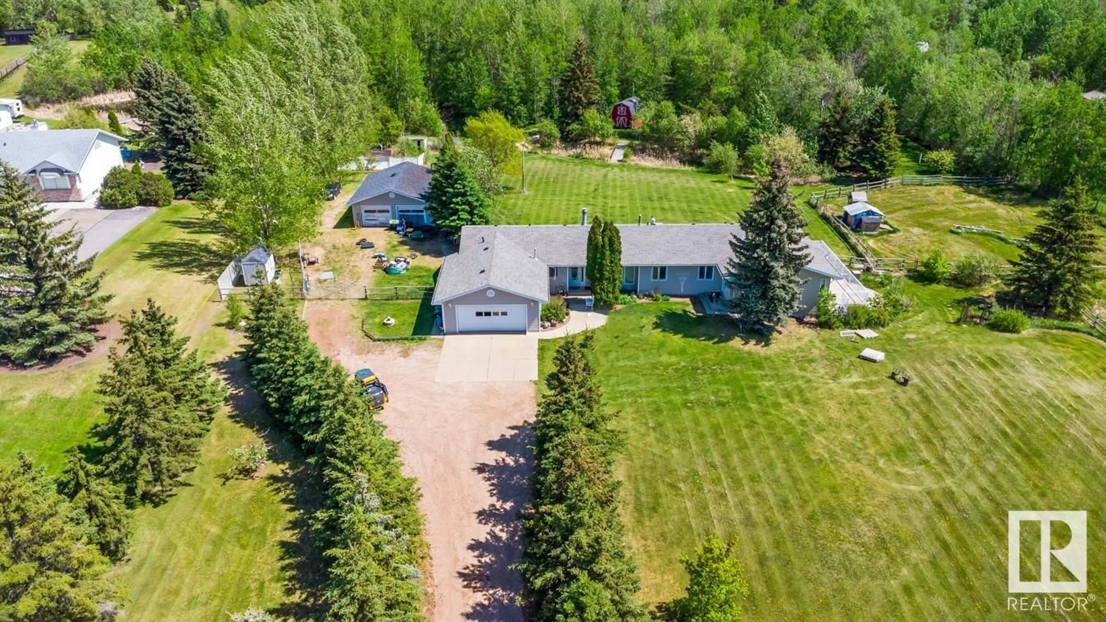 A pic from outside/outdoor area/front of a property/back of a property/a pic from drone, unknown for 314 22550 TWP ROAD 522, Rural Strathcona County Alberta T8C1G8