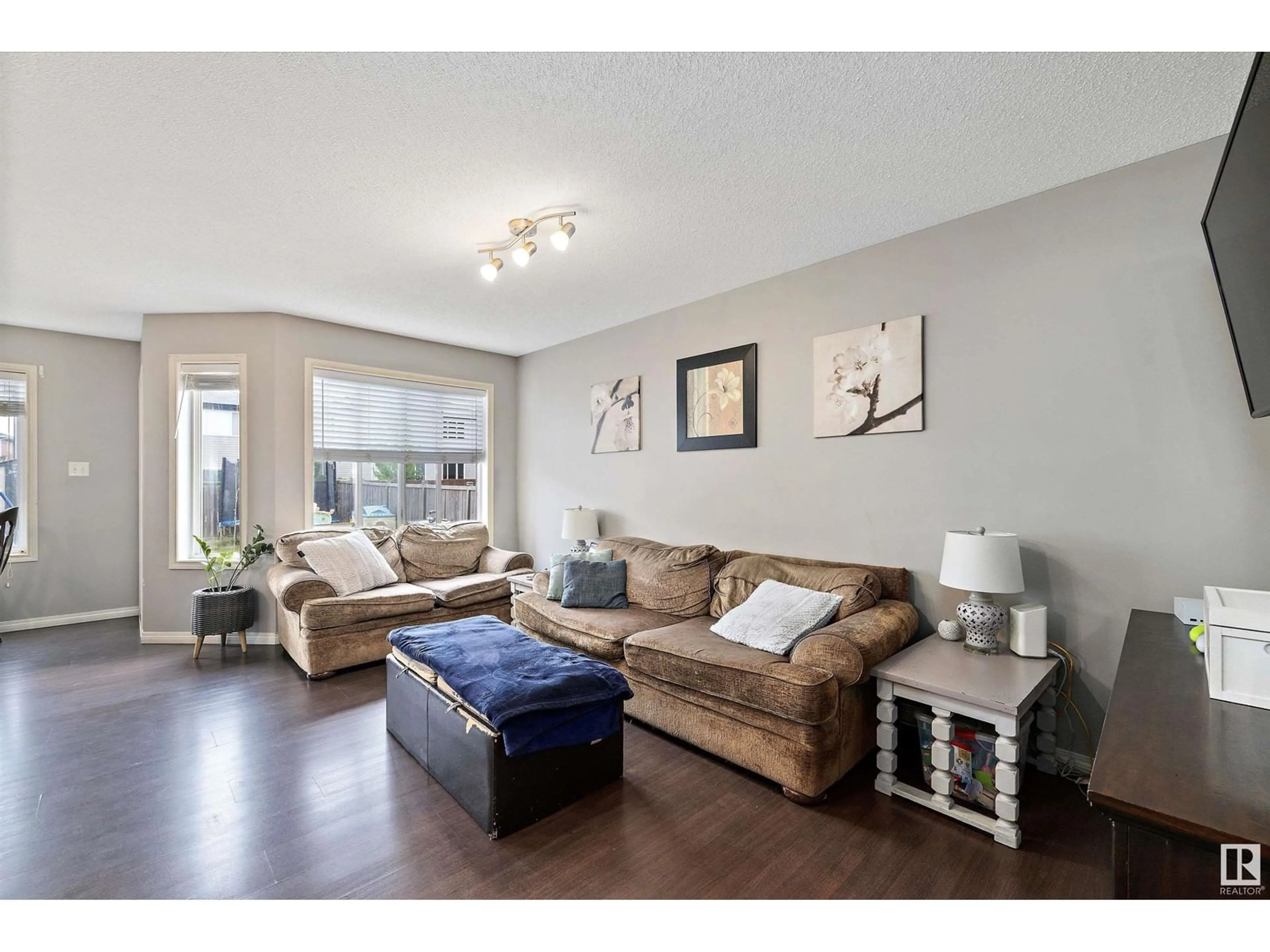 Living room with furniture, wood/laminate floor for 28 CARAGANA WY, Fort Saskatchewan Alberta T8L0H8