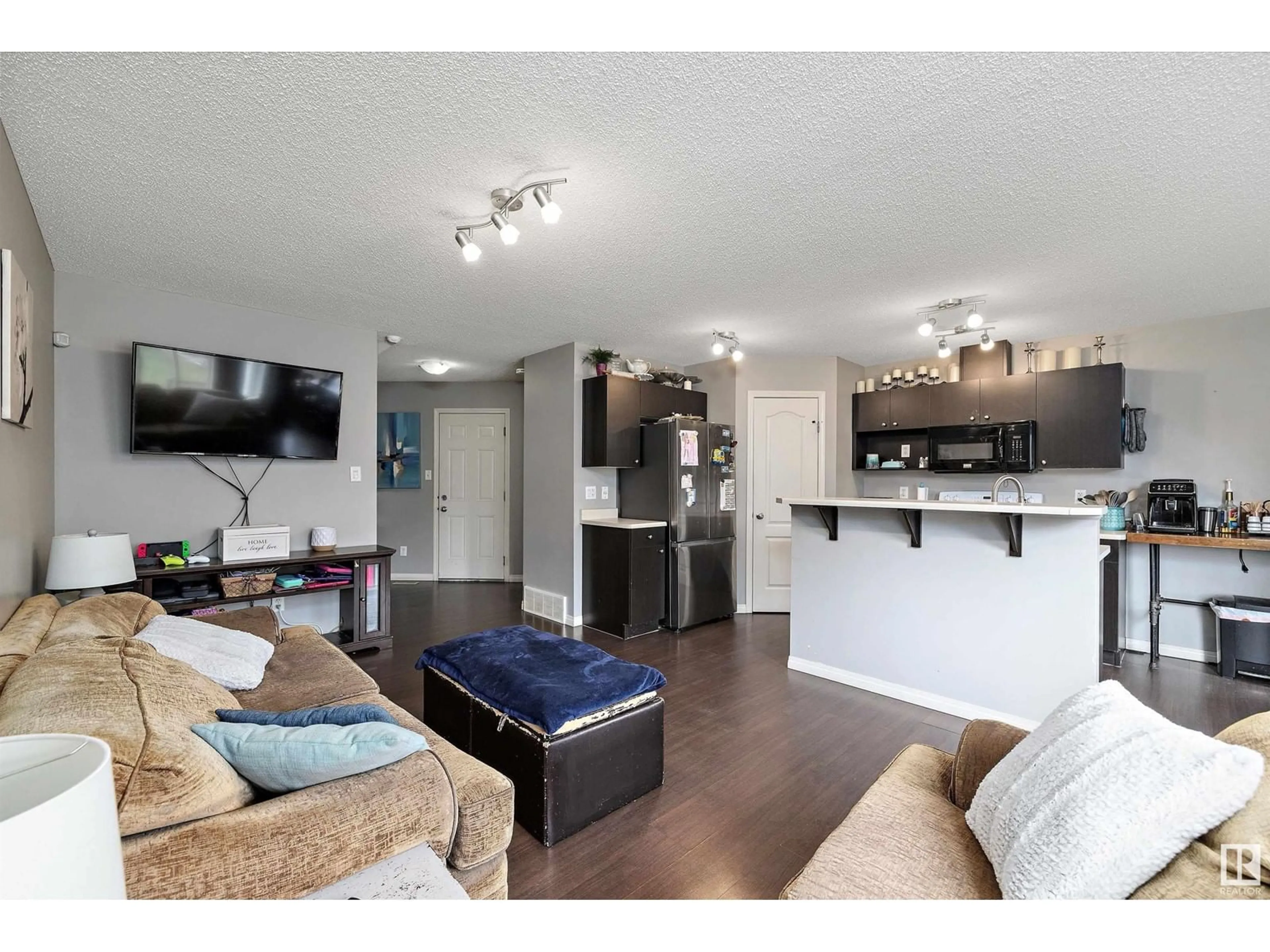 Open concept kitchen, wood/laminate floor for 28 CARAGANA WY, Fort Saskatchewan Alberta T8L0H8