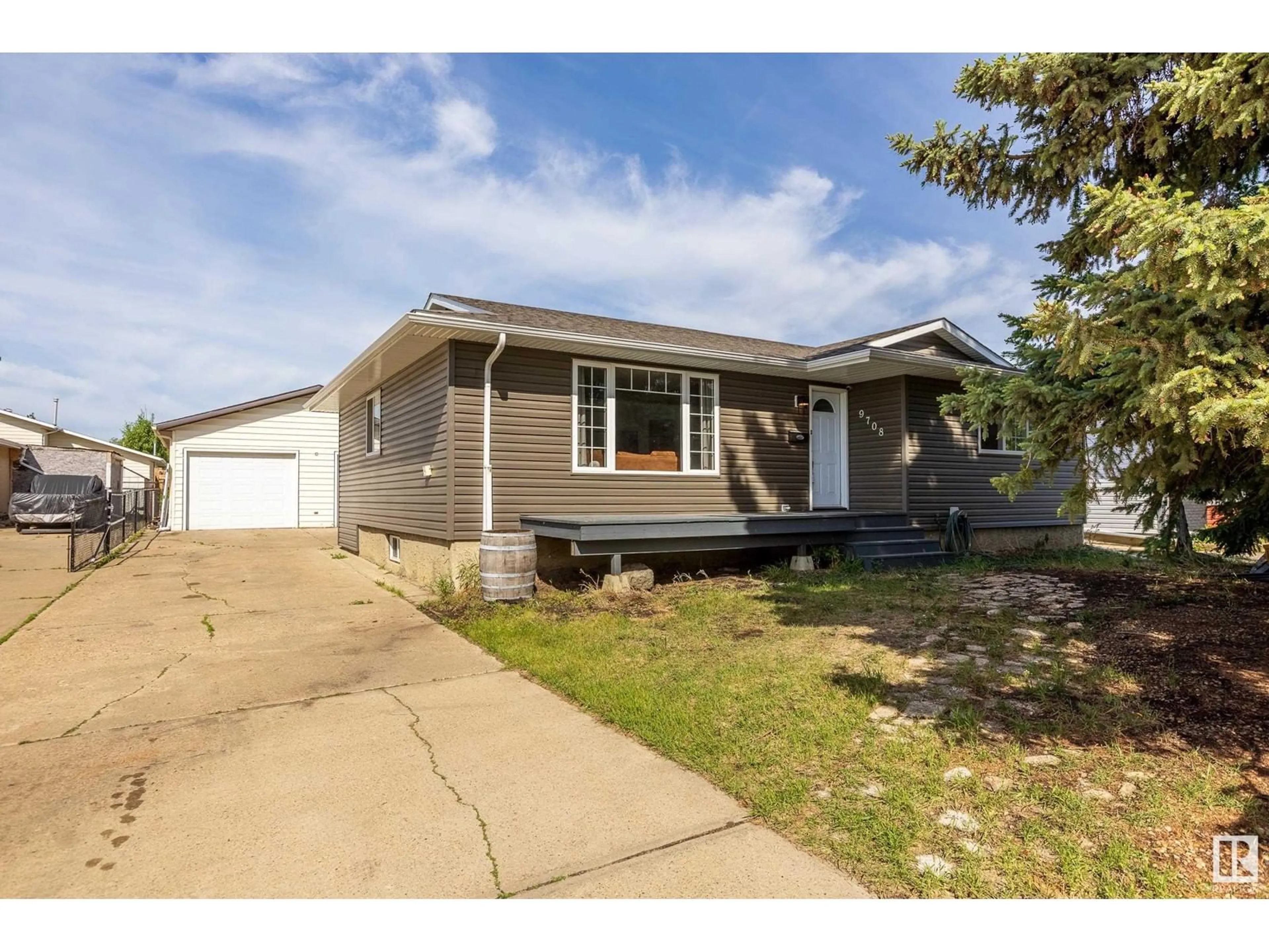 Home with vinyl exterior material, street for 9708 MORINVILLE DR, Morinville Alberta T8R1J2